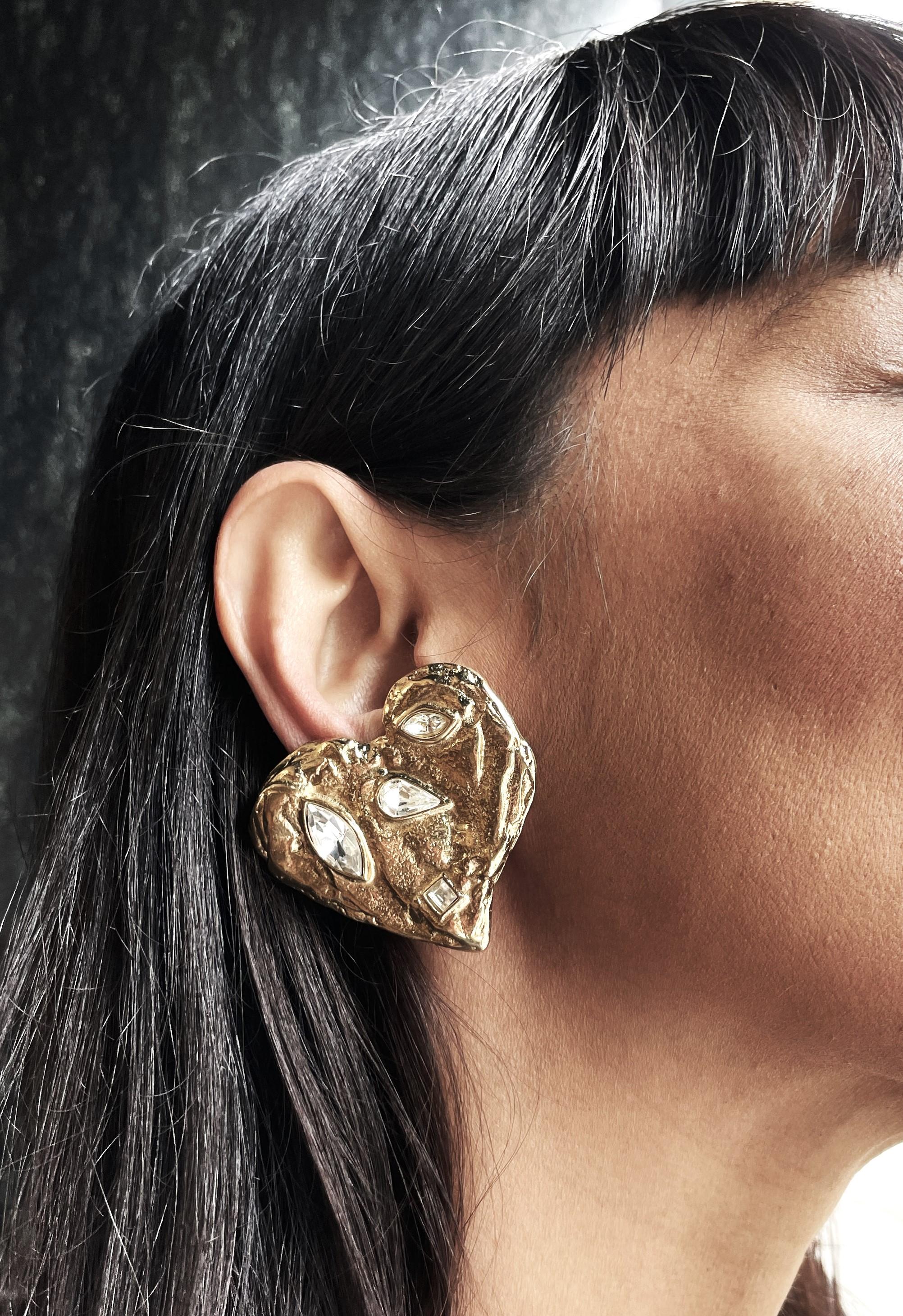 Truly magnificant, fabulous and over sized 'HEART' by YVES SAINT LAURENT Paris earring. 
The large, slightly different golden hearts are decorated with rhinestones in different shapes and sizes, which is so typical for YSL.

Measurement 
Height of