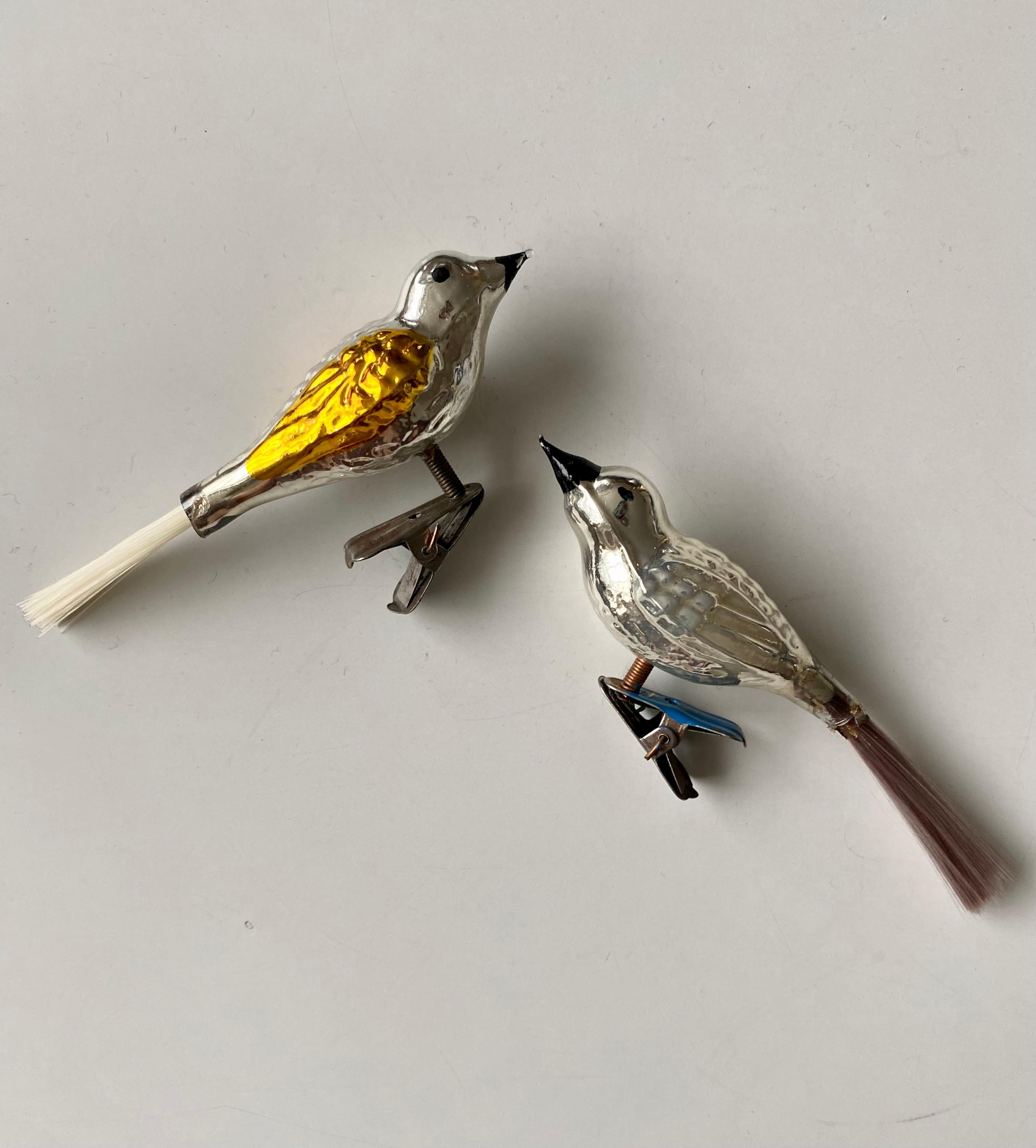 Set of two, most likely, Mercury glass clip-on Christmas birds with long tails. Beautifully decorated and in good condition with normal wear, consisting their age. European pieces.
