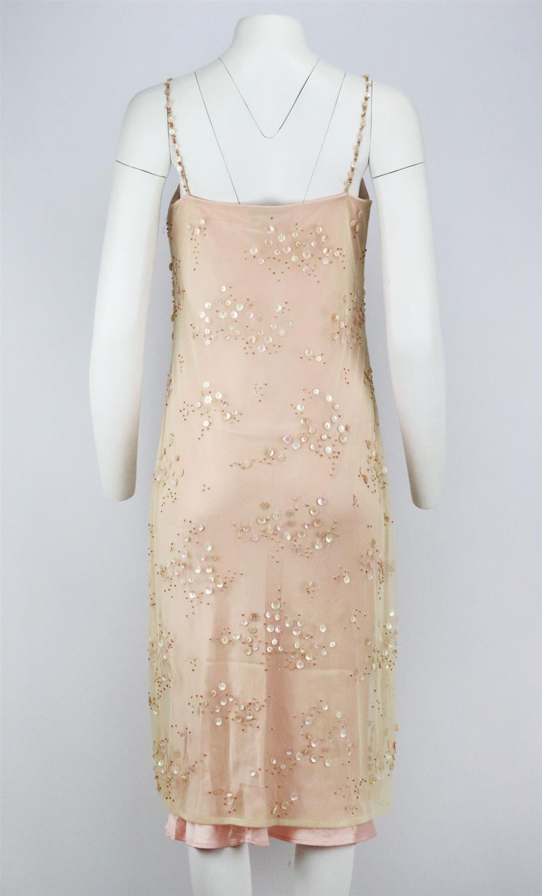 This vintage dress by Clips is made from bead embellished tulle and satin, it's cut for a slim with cut out back. Pink satin, cream tulle. Hook fastening at back. 64% Acetate, 36% viscose. Size: IT 46 (UK 14, US 10, FR 42). Bust measures approx.