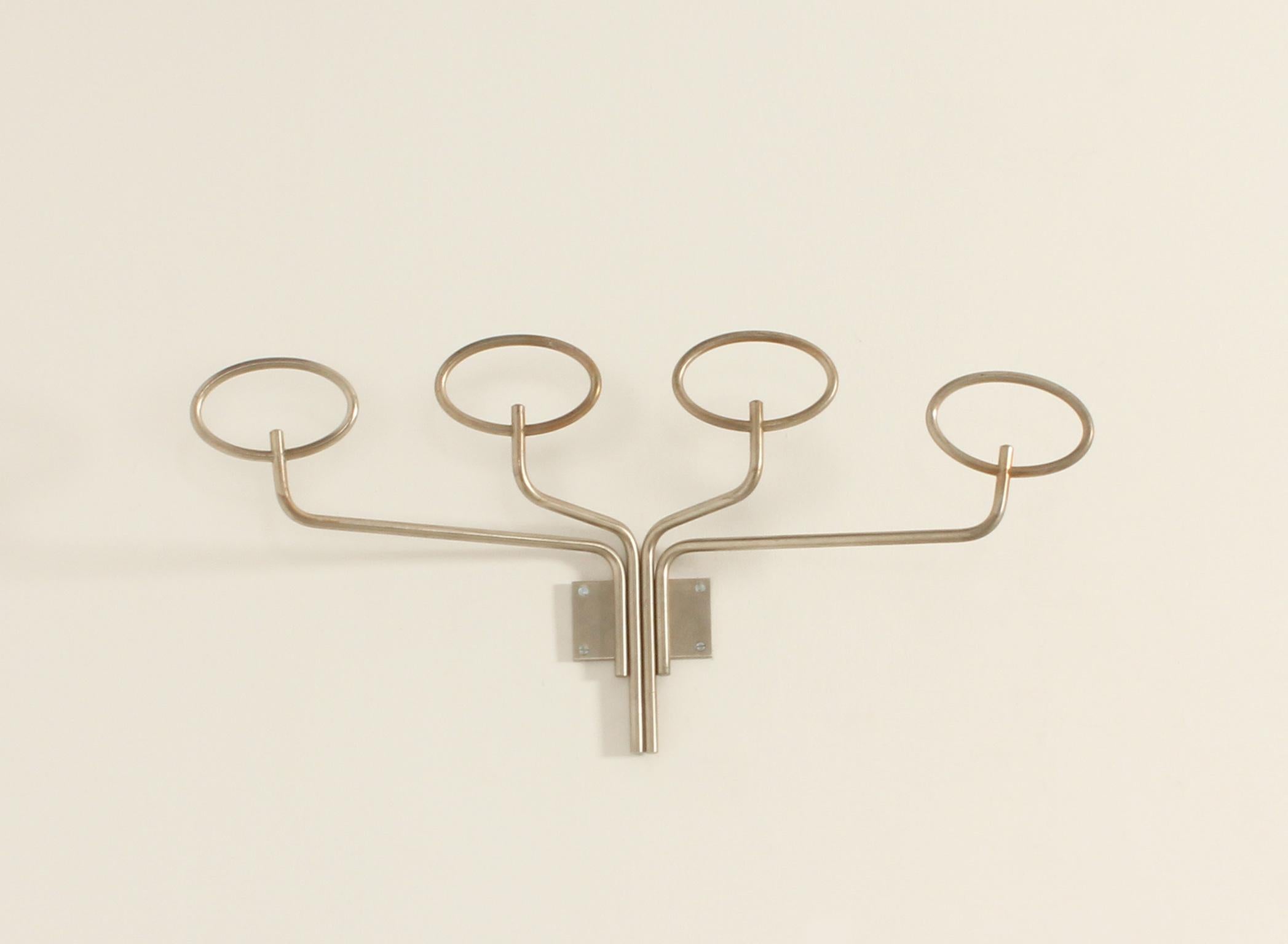 Clitoquattro coat rack designed in 1960's by Sergio Mazza for Artemide, Italy. Nickel plated solid brass with four oval-shaped hangers. 