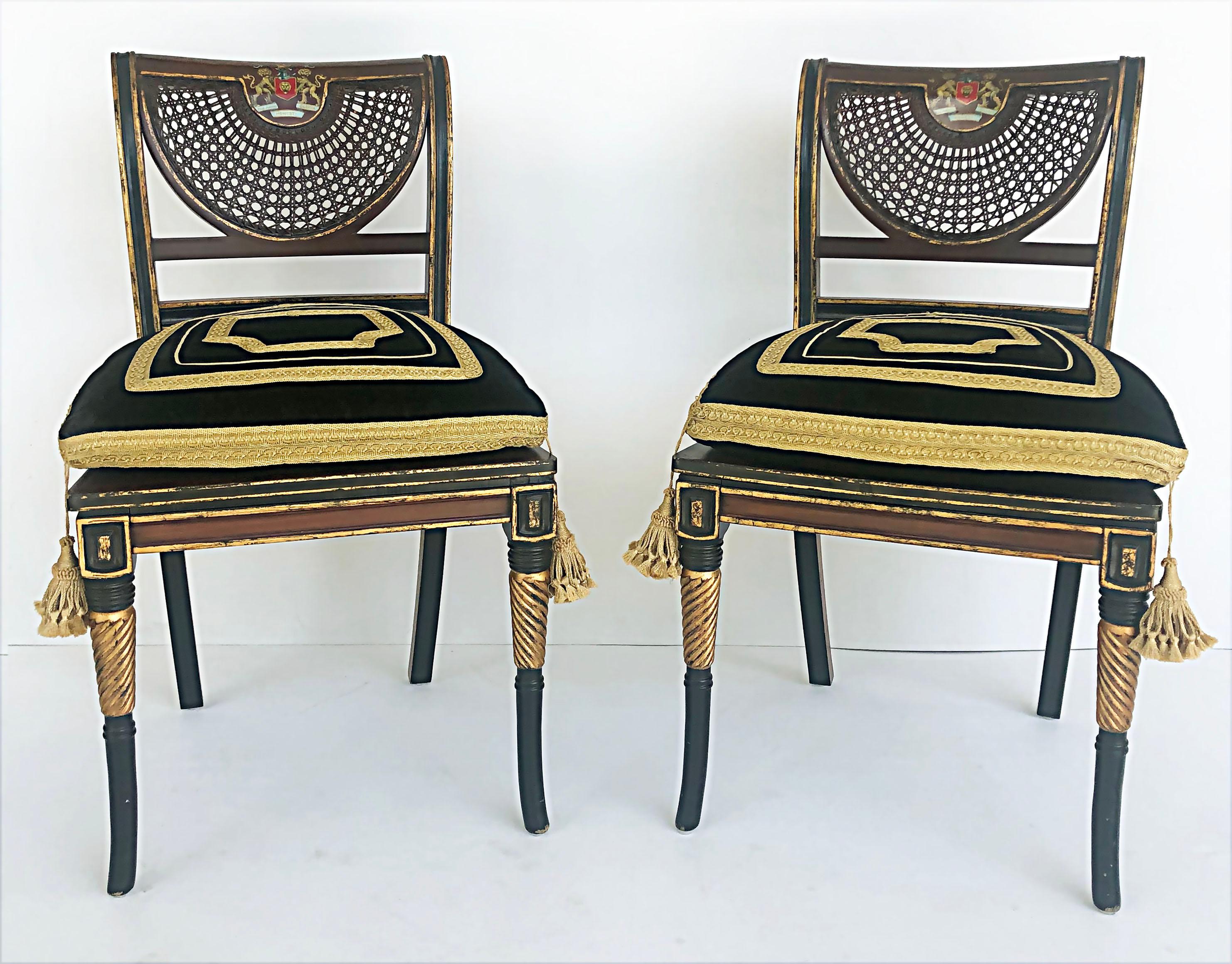 Clive Christian Regency style hand-painted caned chairs with coat of arms, pair

Offered for sale is a pair of Clive Christian Regency-style hand-painted caned chairs. This highly stylized parcel gilt pair of chairs has a fan-shaped caned detail