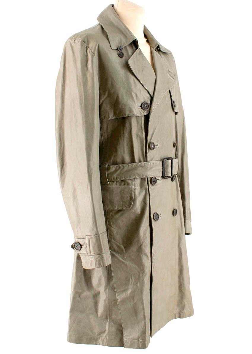 Cloak Green Leather Trench Coat

- Large, wide collar, double breasted
- Buttery soft leather
- Rustic brown plastic buttons
- Belt with rustic buckle
- Buttons on the sleeves
- Two spacious pockets on the front
- Slit at the back

Materials
- Outer