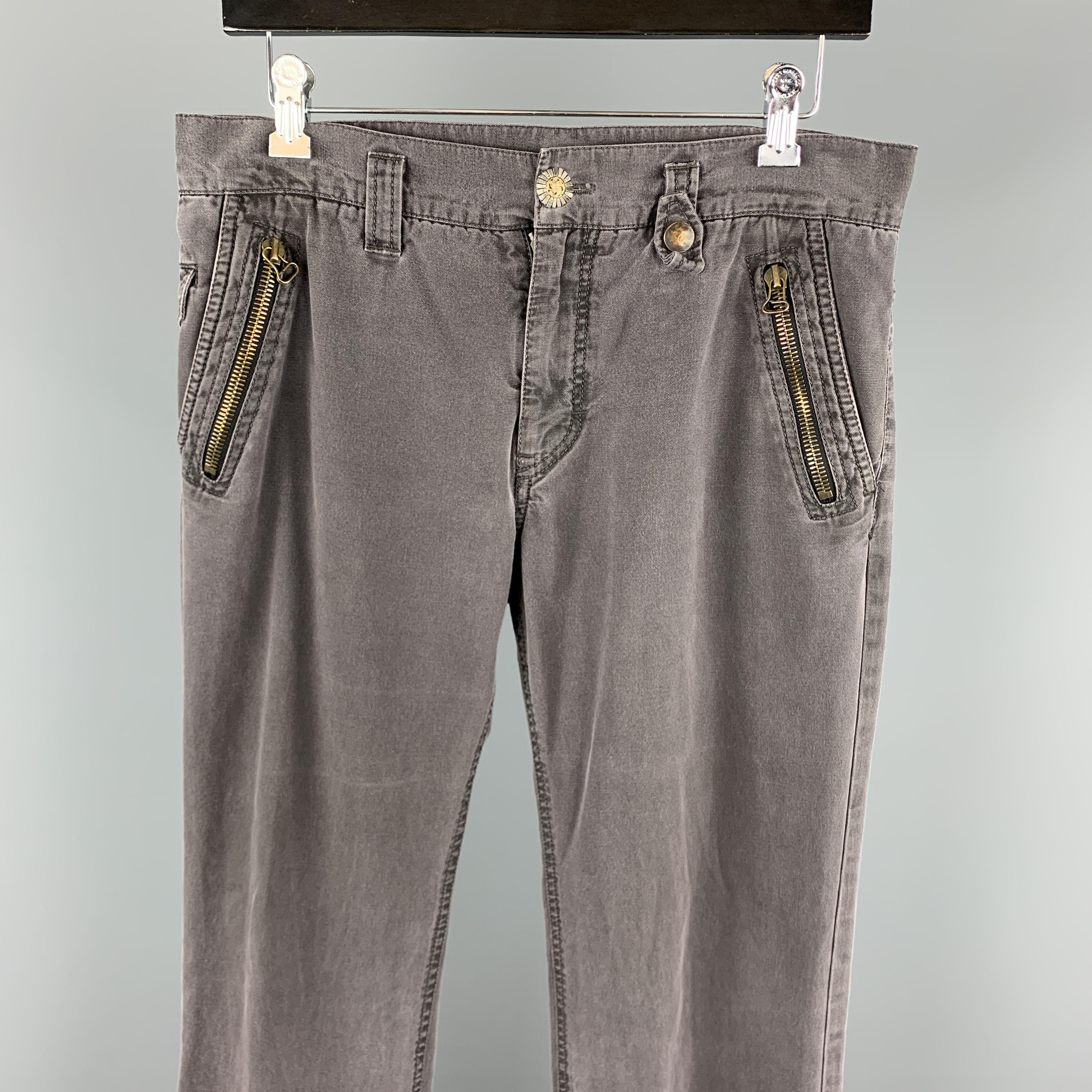 CLOAK casual pants comes in a charcoal wash cotton featuring zipper pockets and a zip fly closure. Made in Italy.

Very Good Pre-Owned Condition.
Marked: 32

Measurements:

Waist: 32 in. 
Rise: 9 in. 
Inseam: 31 in. 