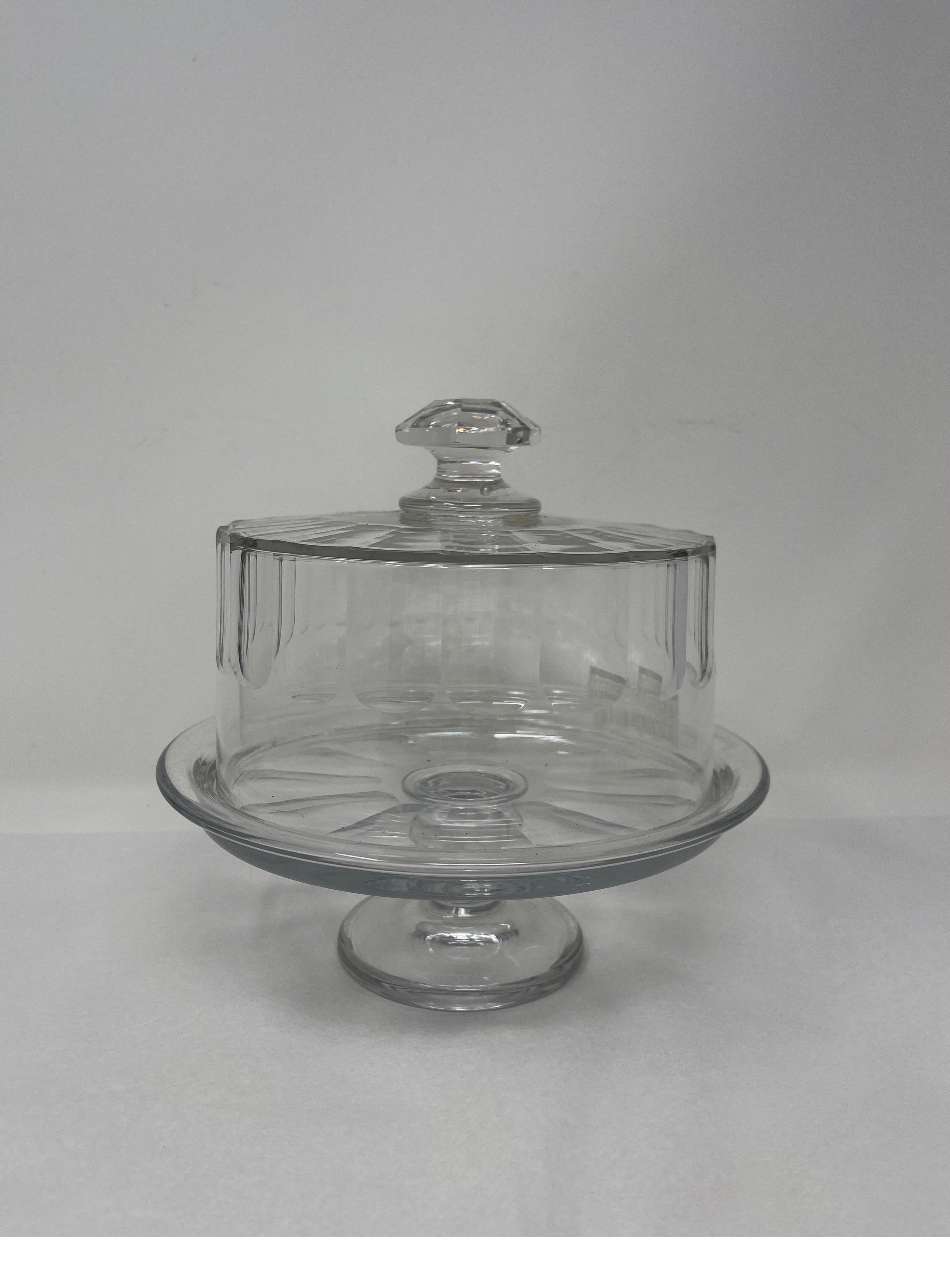 French patisserie cut glass dome cloche with stand. This cloche with beautiful cut glass detailing and stand would look beautiful on a kitchen counter to display cakes or cheeses. 

Measures: 8” diameter x 8” height.