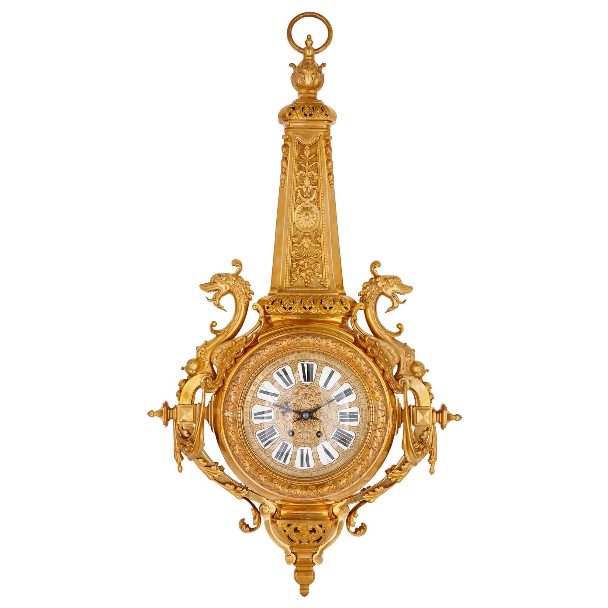 Clock and barometer set in gilt bronze by Beurdeley.
French, late 19th century.
Measures: height 98cm, width 52cm, depth 12cm.

The exceptional wall clock and barometer in this pair are wrought from gilt bronze in the eclectic Belle Epoque