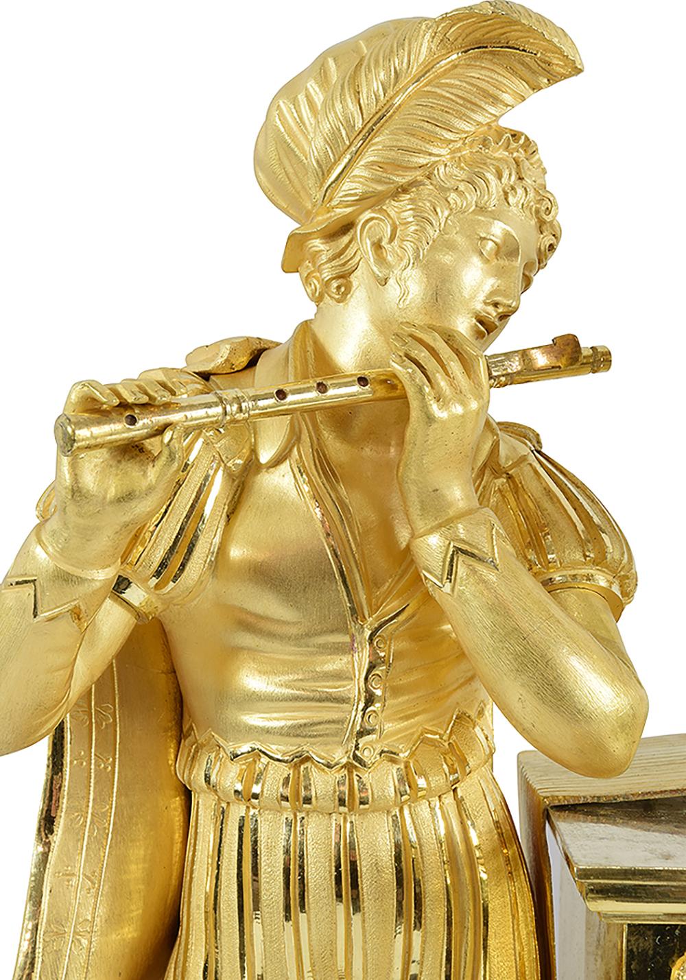 Empire period clock in gilded bronze with mercury on the main theme of the troubadour. in the style of the Renaissance with a decoration of a large character, finely chiseled wearing a typical costume of the time, playing the flute. His gaze turns