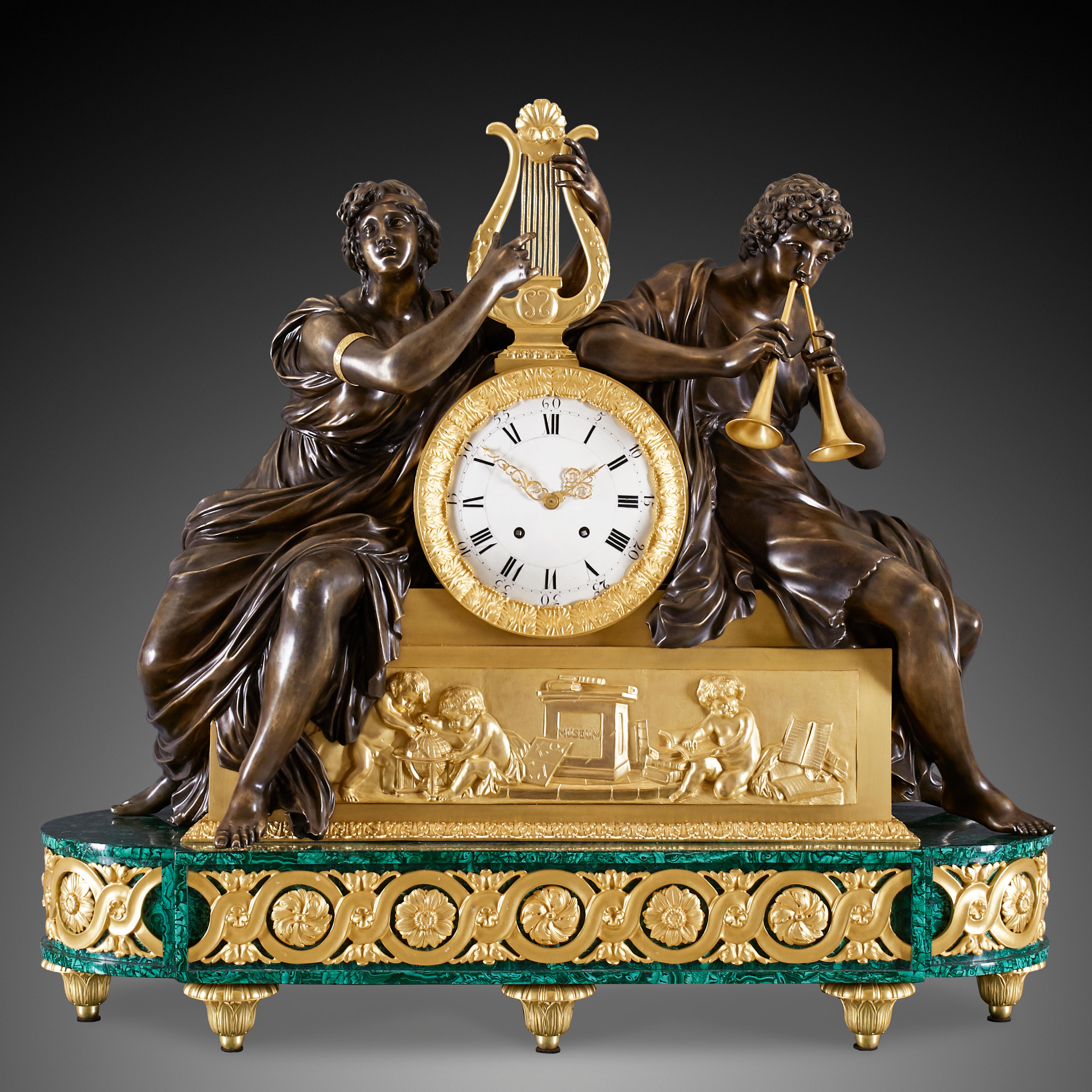 This antique clock set consists of two important pieces which are the mantel clock and the decorative garnitures. The set derives from the Louis Philippe I and Charles X period and is crafted in the characteristic Restoration style of that time. In