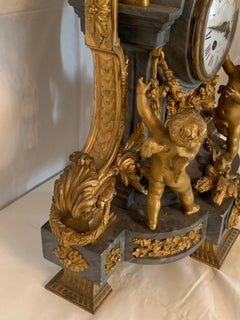 Clock set 3 pieces marble and bronze with cherub