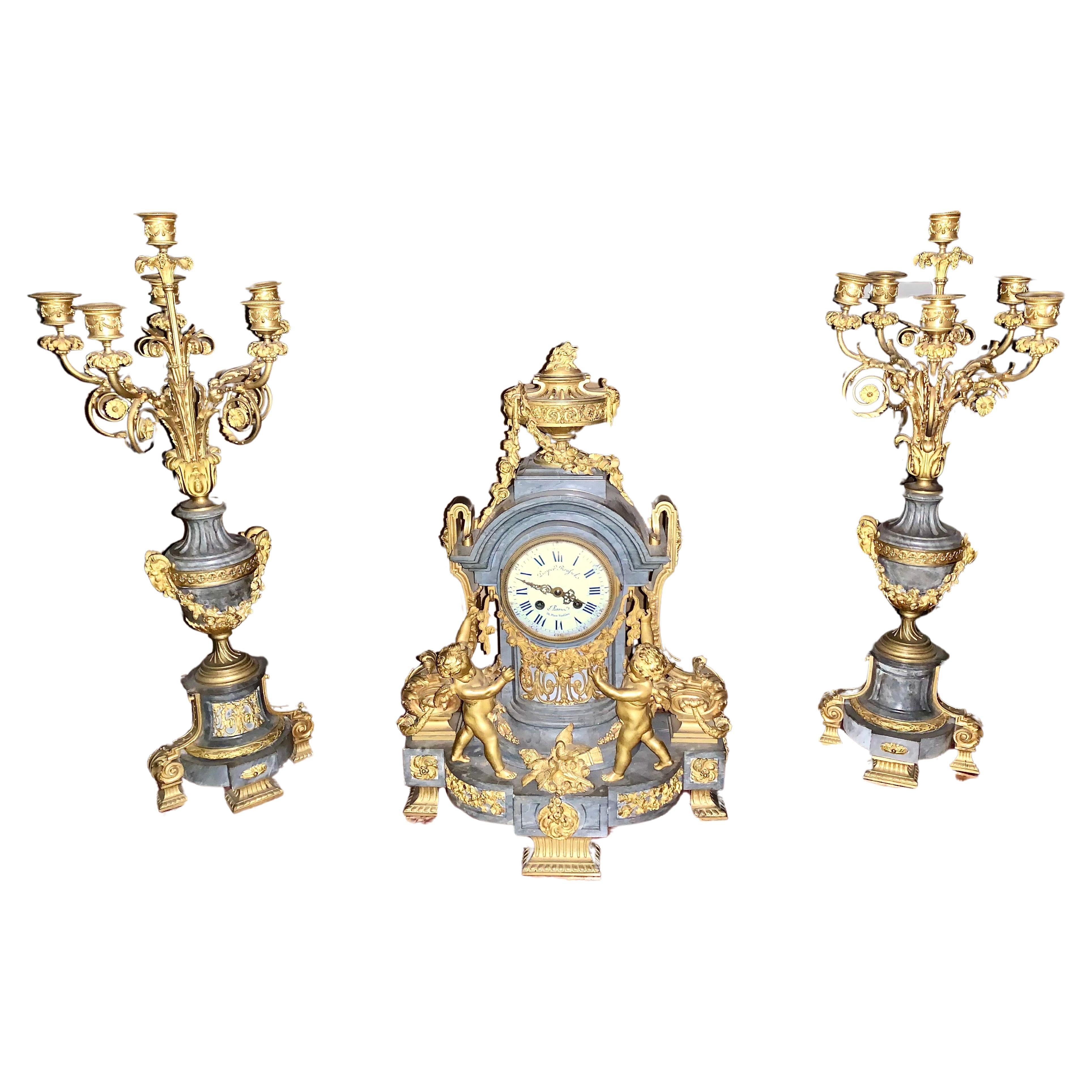 Clock set 3 pieces marble and bronze with cherub  For Sale