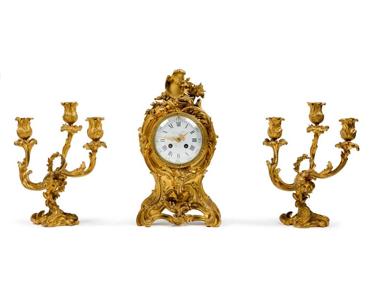 Clock set three pieces louis XV style in bronze ,quality and detail are very finely executed
Dimensions of the candelabras
H: 11 inch W: 6.5
Clock dimension are in description.