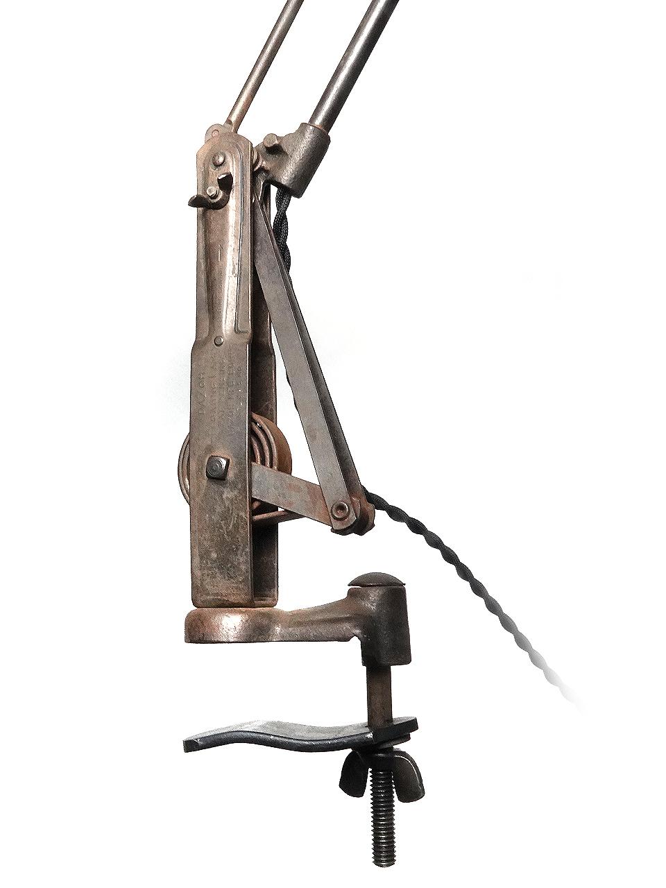 I always liked this early desk lamp and use one myself. It has a nice clean and elegant profile. It also stands taller than most with a running length of 58 inches. What sets it apart is the tight coiled spring in the swivel/clamp base. Its the same