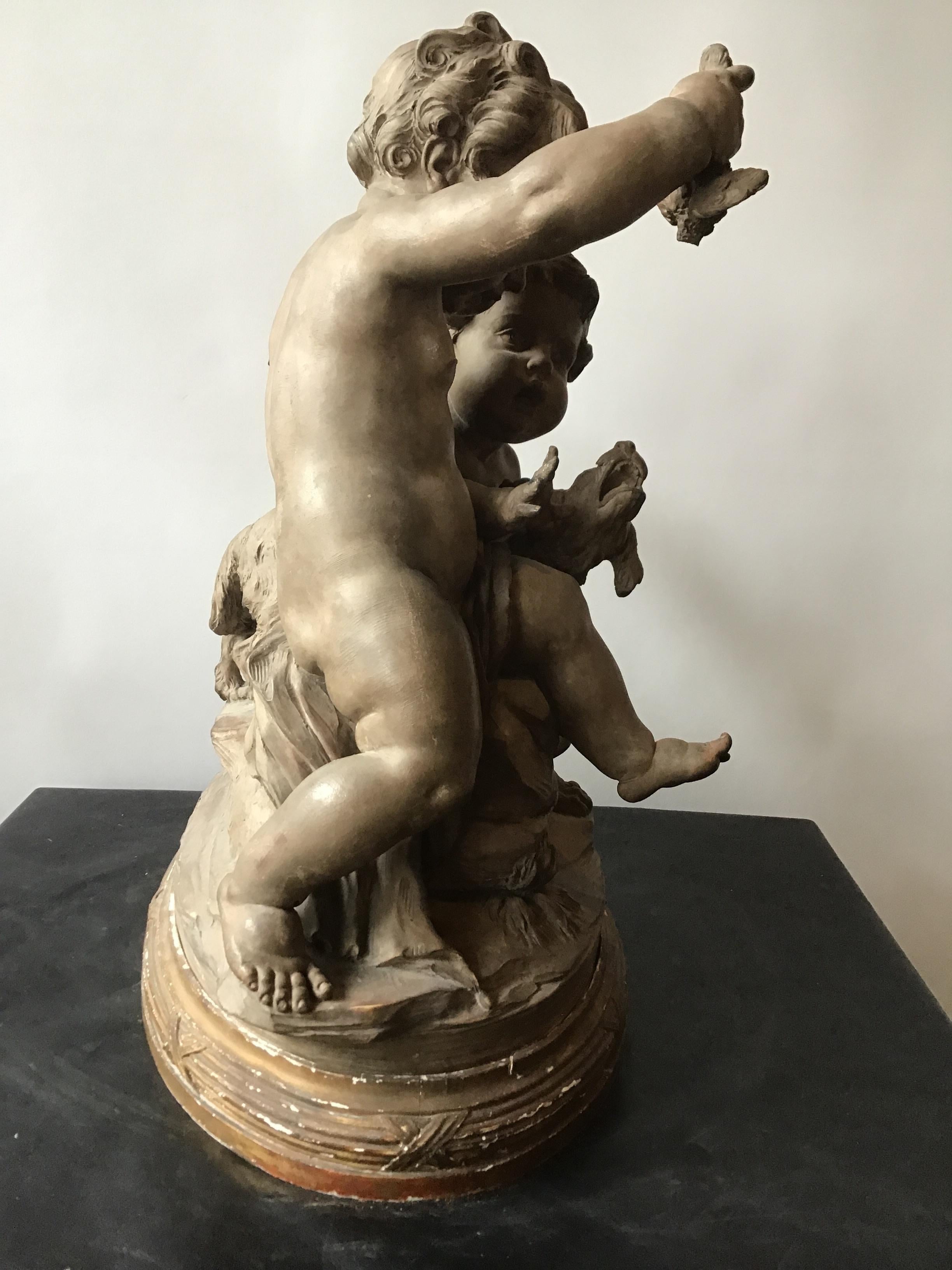 Clodian Terracotta Sculpture of Cherubs and Dog For Sale 1