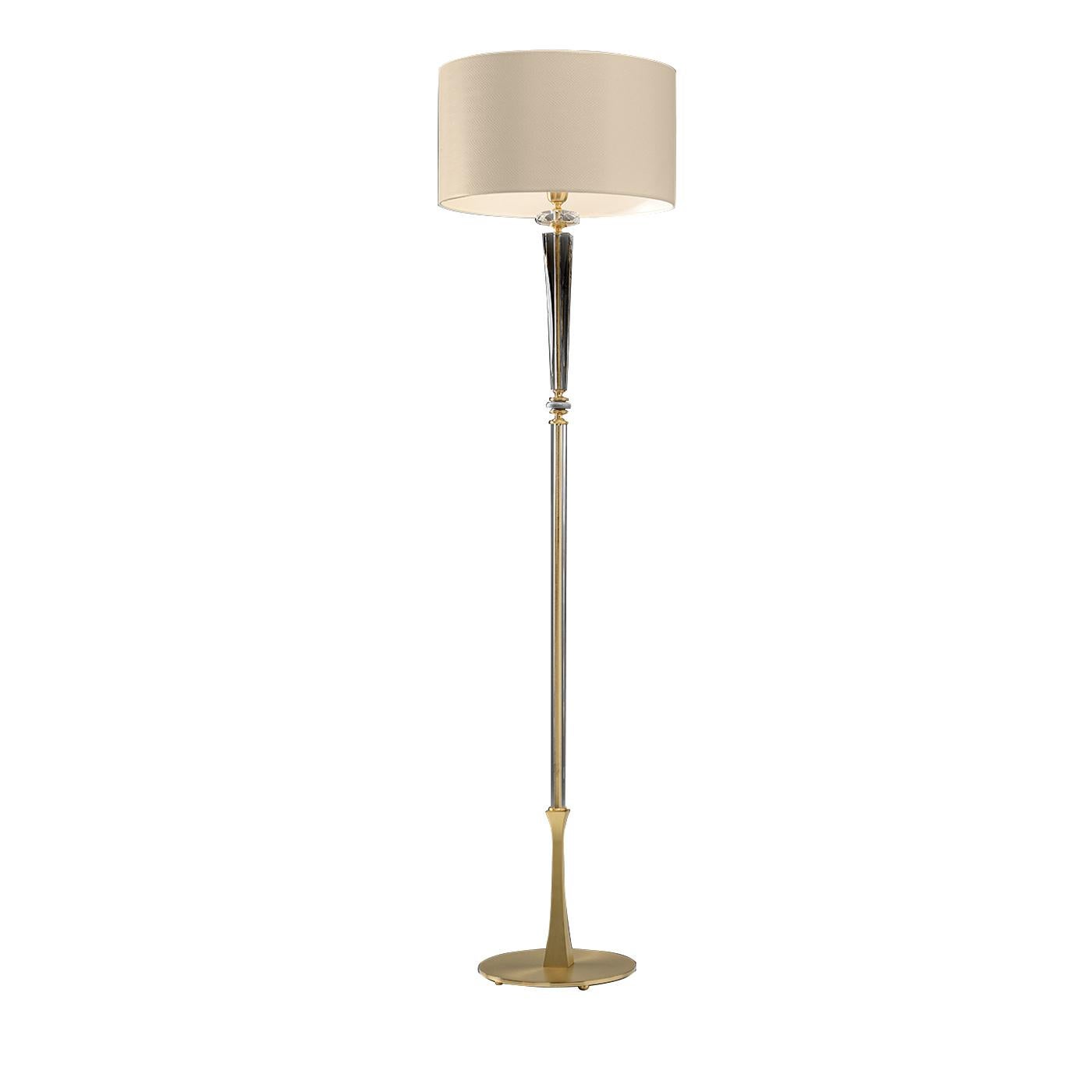 Simple yet elegant, this floor lamp designed by Euroluce Light of Italy has a slim metal body with round base in gold satin finish and a clear blown-glass conical element with golden details that deliver classic sophistication. The neutral drum