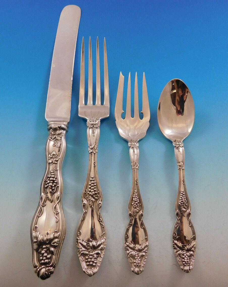 Gorgeous dinner size Cloeta by International circa 1904 sterling silver flatware set - 67 pieces, with beautiful grape motif. This set includes:

12 large banquet size knives, 10