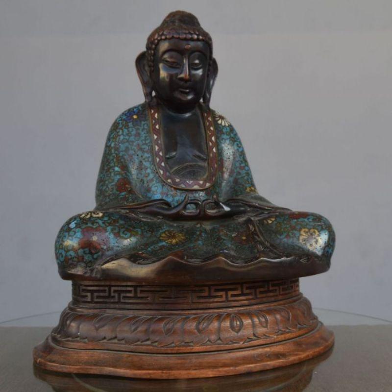 Cloisonne bronze Buddha on its wooden base. XIXth century.

Additional information:
Material: Bronze.
 