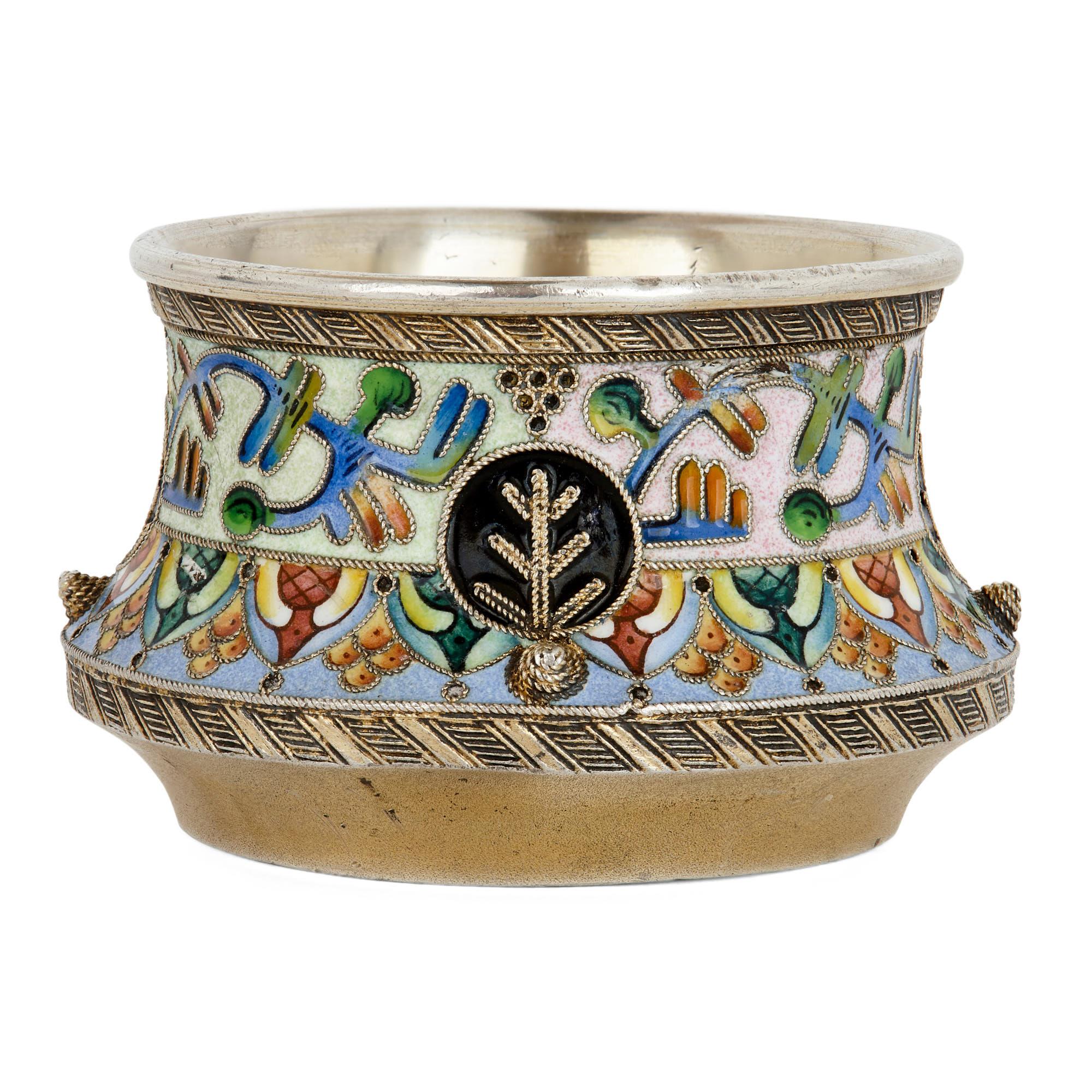 A Salt is a decorative but perfectly functional salt cellar. During the early 20th century, Russian artisans used the form of the Salt, much like they did the Kovsh, as a means of demonstrating their technical skill. This Salt, which was crafted in