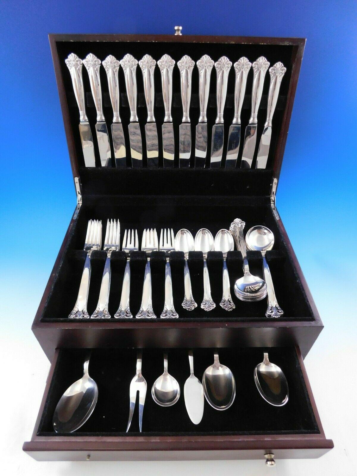 Rare dinner size cloister by Th. Marthinsen Norwegian sterling silver flatware set with unique pierced handle, 66 pieces. This set includes:

12 dinner size knives, 9 1/2