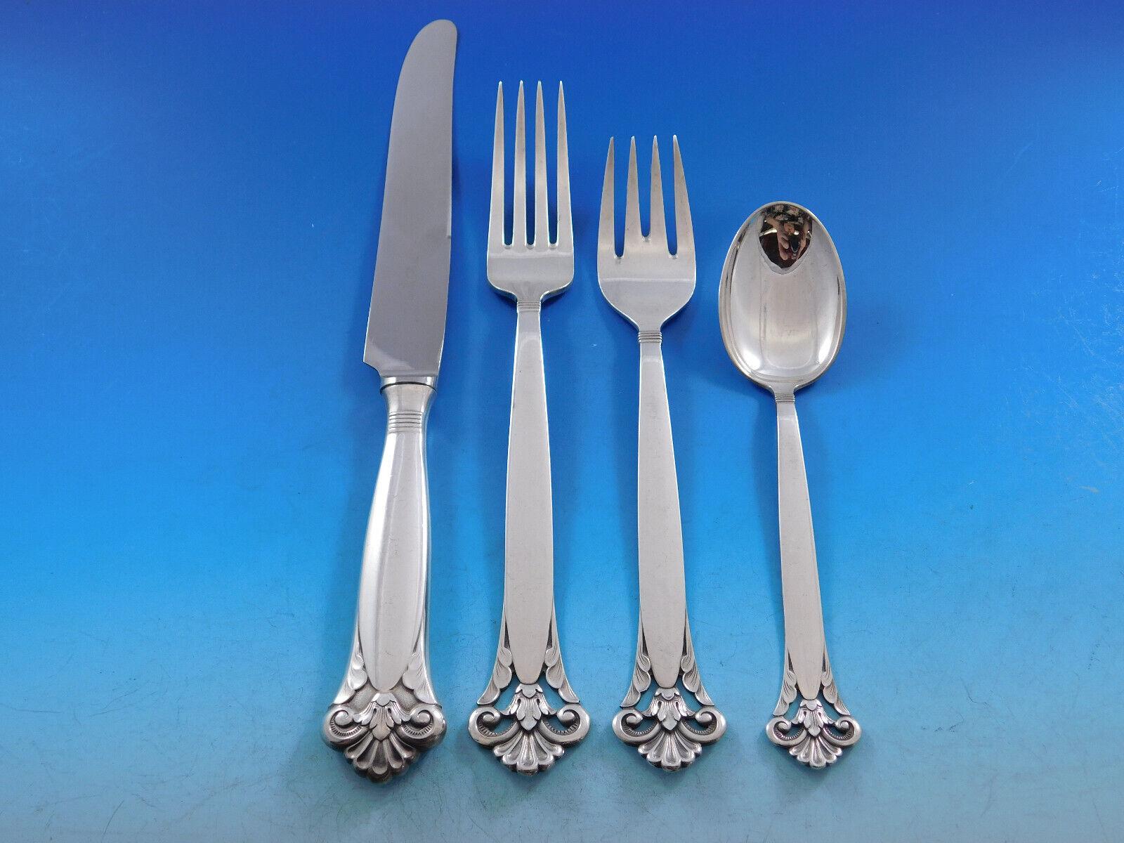 Scarce Cloister by Marthinsen, Norway, Sterling Silver flatware set with gorgeous pierced handle - 64 pieces. This set includes:


12 Dinner Knives, 9 5/8