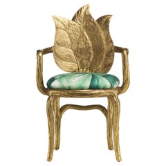 Fauteuil Clorophilla Gold composé de feuilles sculptées en tissu vert