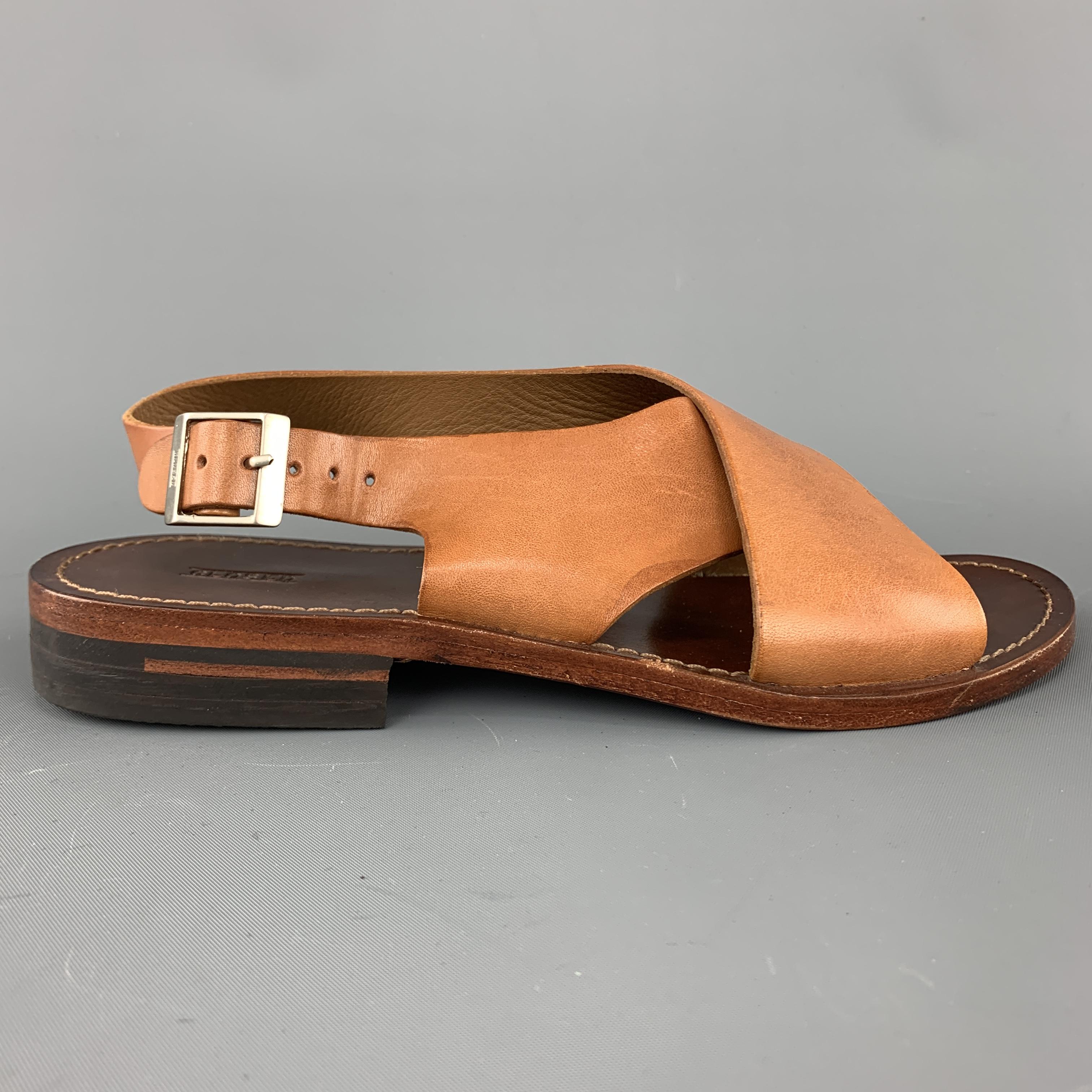 Ankle strap sandals come in tan leather with a cross strap and sling back. 
 

Very Good Pre-Owned Condition. Retails: $360.00.
Marked: IT 36

Outsole: 9.5 x 3.5 in. 