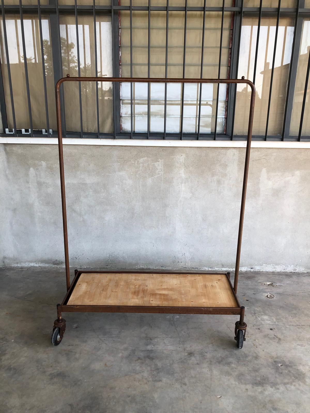Clothes hanger industrial iron wheeled trolleys. Size: D 51 cm, W 120 cm. Quantity available n 6

Industrial iron wheeled trays with or without wooden shelves. From Italy from mid century period.
Trolleys are made of industrial tubular iron with net