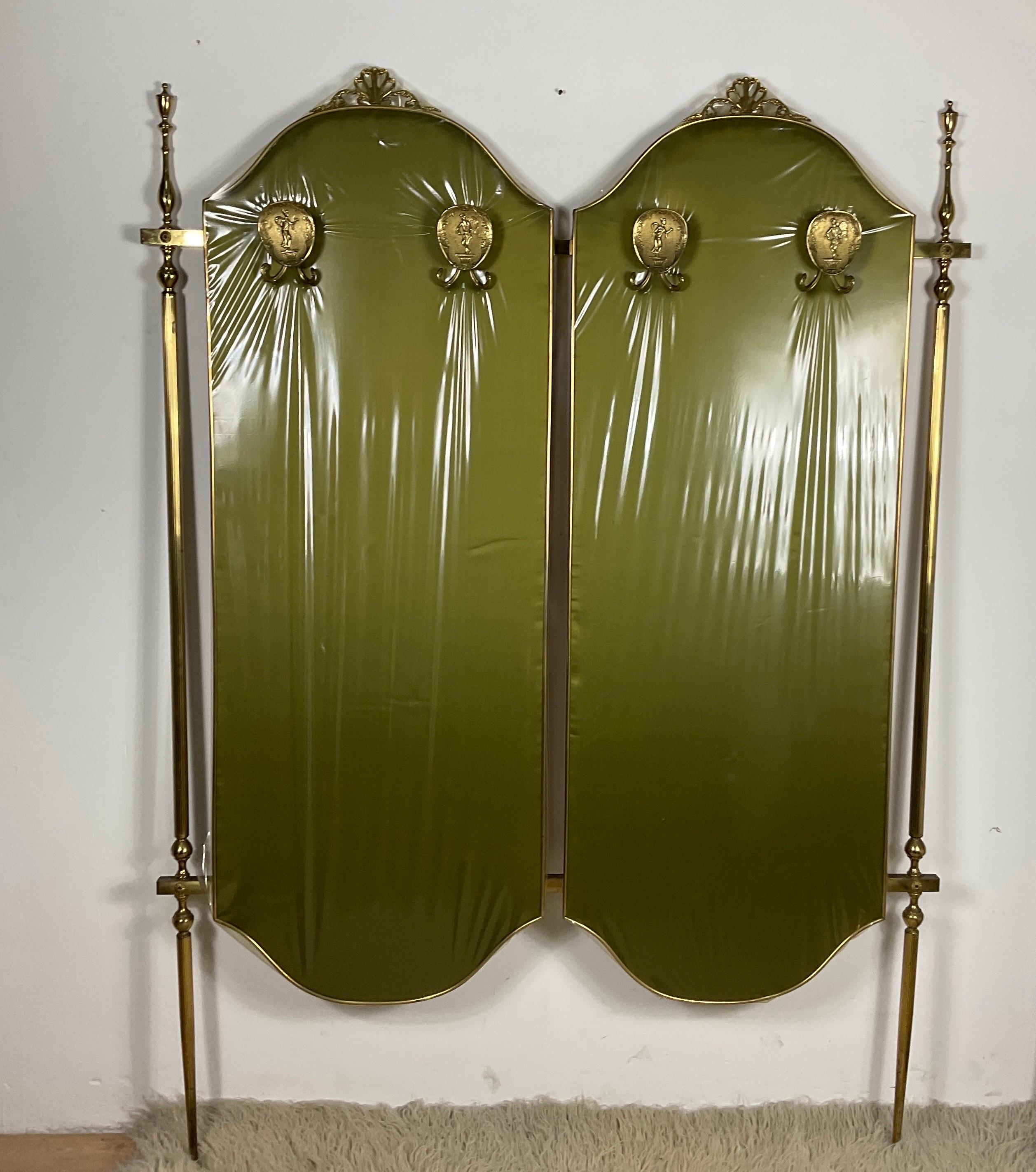 Clothes rack with brass structure, covered with wood at the back and with green fabric at the front of 60s