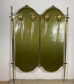 Clothes rack with brass structure, covered with wood at the back and with green