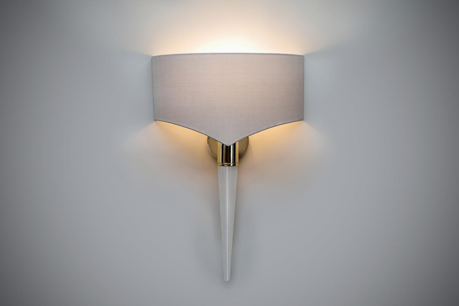 Designed with the famous Cartier ‘Clou’ bracelet in mind, this stunning light has been handmade with carefully polished rock crystal and finished in polished brass. The bespoke-made shade compliments the shape beautifully.

Each light is limited in