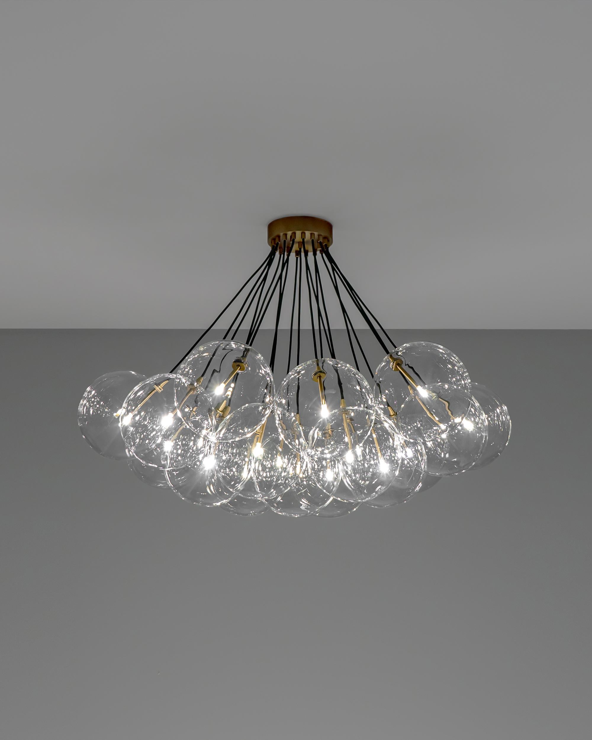 Cloud 250 chandelier by Schwung
Dimensions: D 119.5 x H 84.9 cm
Materials: Borosilicate Transparent Glass, Lacquered Burnished Brass
More finishes available. Please contact us

LED Bulb (included) 19 x 1.6 W
Max Wattage 19 x 2 W
Total Lumens 3420