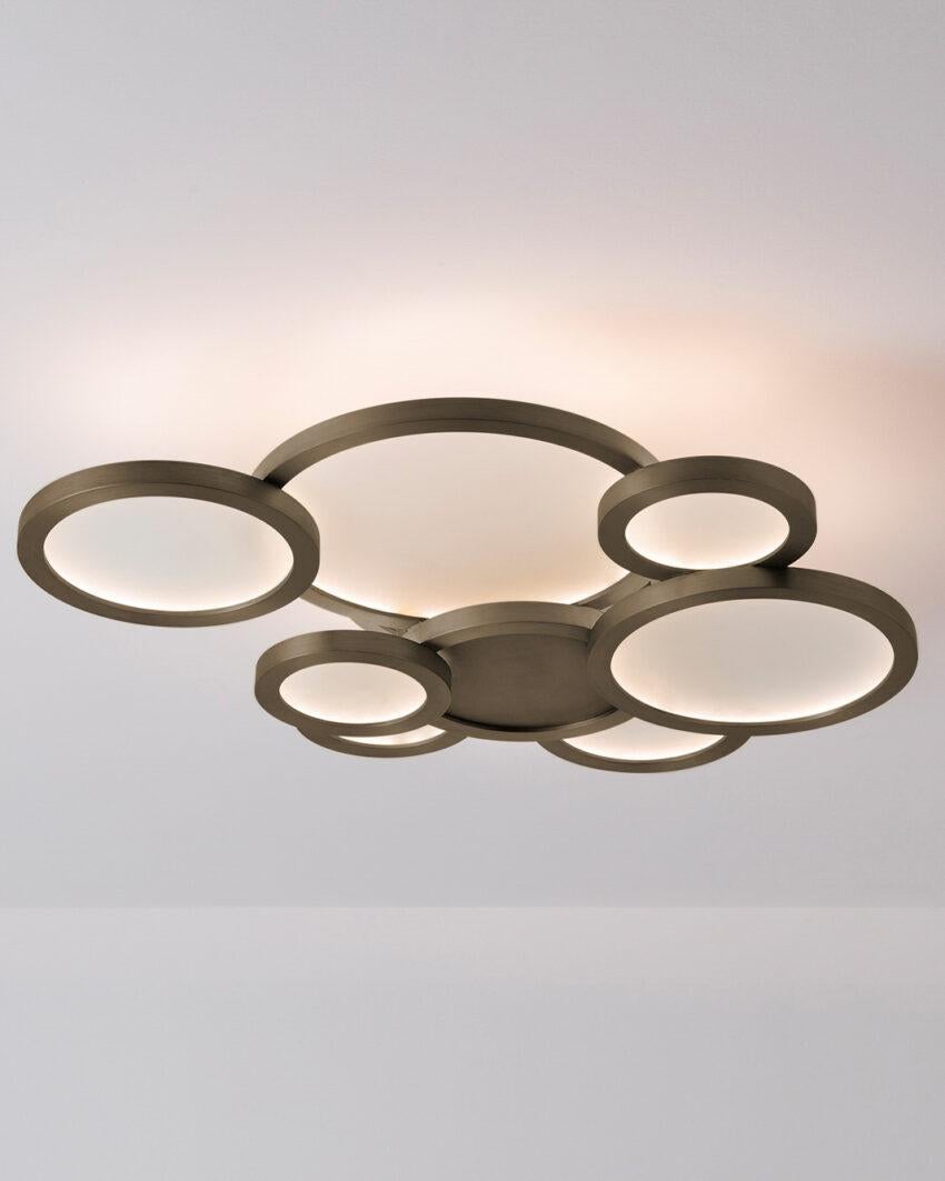 Cloud Brushed Bronze Ceiling Mounted Lamp by Carla Baz
Dimensions: D 75 x W 58 x H 16 cm.
Materials: Brushed bronze.
Weight: 16 kg.

Available in different finishes and materials: brushed brass, brushed bronze and brushed copper. Please contact us.
