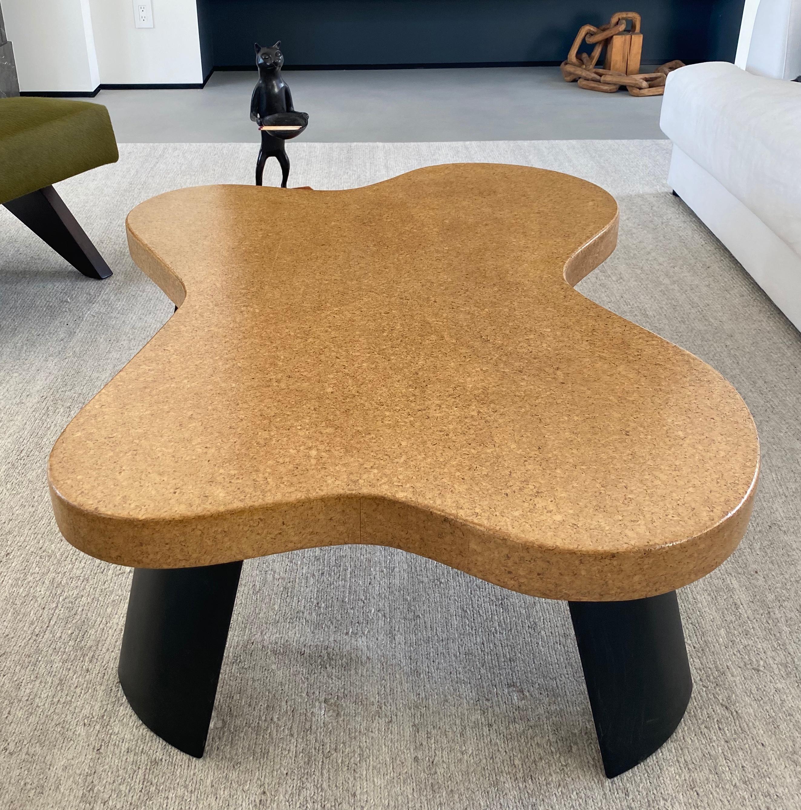 Morphic, signature Paul Frankl cloud coffee table model 5005 designed for Johnson Furniture Company, 1951. The table is in very good condition with a natural waxed cork top and darkened mahogany legs. Minor water aging on top and ding on one of the