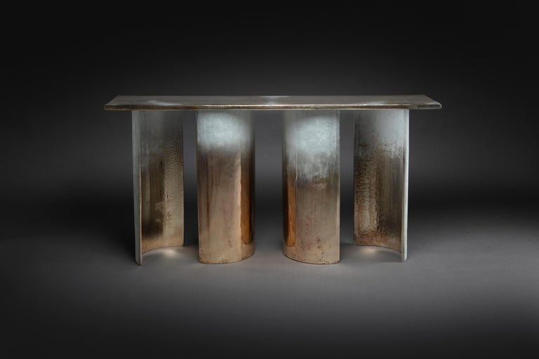 Poured glass table, sandblasted and acid etched with hand silvered liquid precious metals, including 24 carat gold, floated on the surface. 
Cloud Console was born as part of the search for the simplest, most elegant and at the same time, poetic