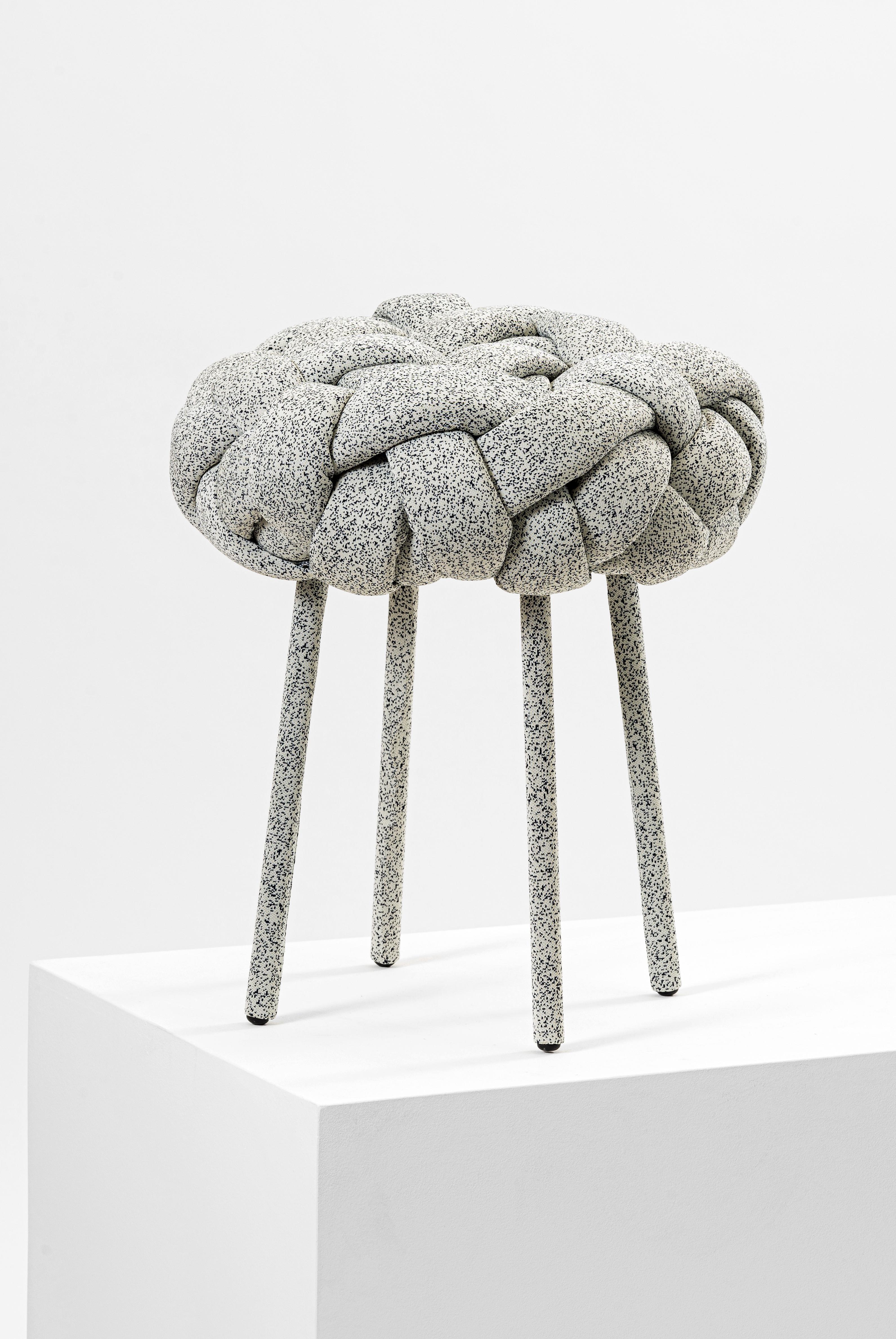 This contemporary stool is part of the Cloud collection, which was created around the concept of weft. These contemporary stools and benches are made with fabric and foam stripes, woven and stitched by hand. Each piece is unique, as the result of