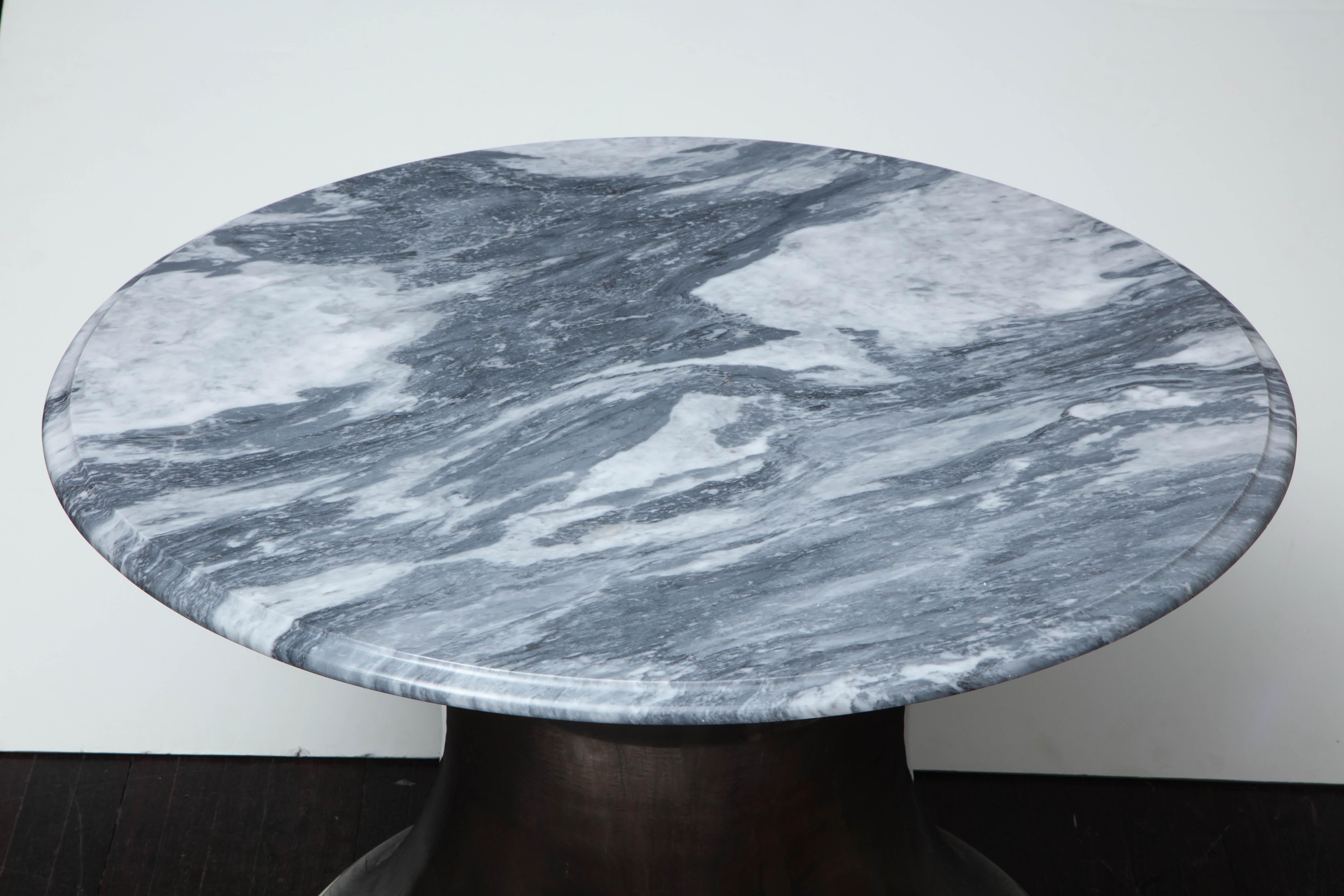 Beautiful cloud gray marble coffee table with elegant Olpe shaped stainless steel base.