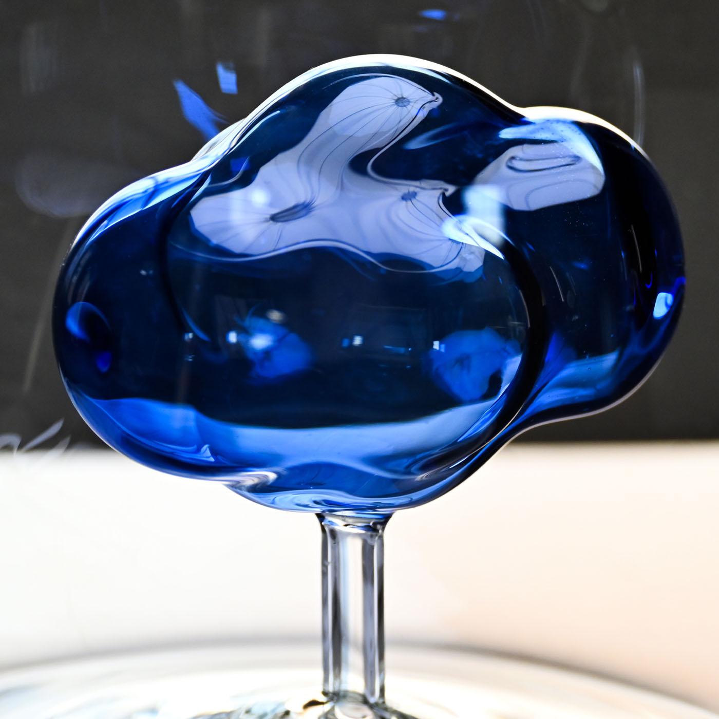 Glass Jug, with a blue cloud inside. Superbly handcrafted by master artisans of the Venetian glassmaking tradition, this jug has a dreamlike taste. Showcasing a classic transparent silhouette, the piece is adorned with a blue glass cloud inside.