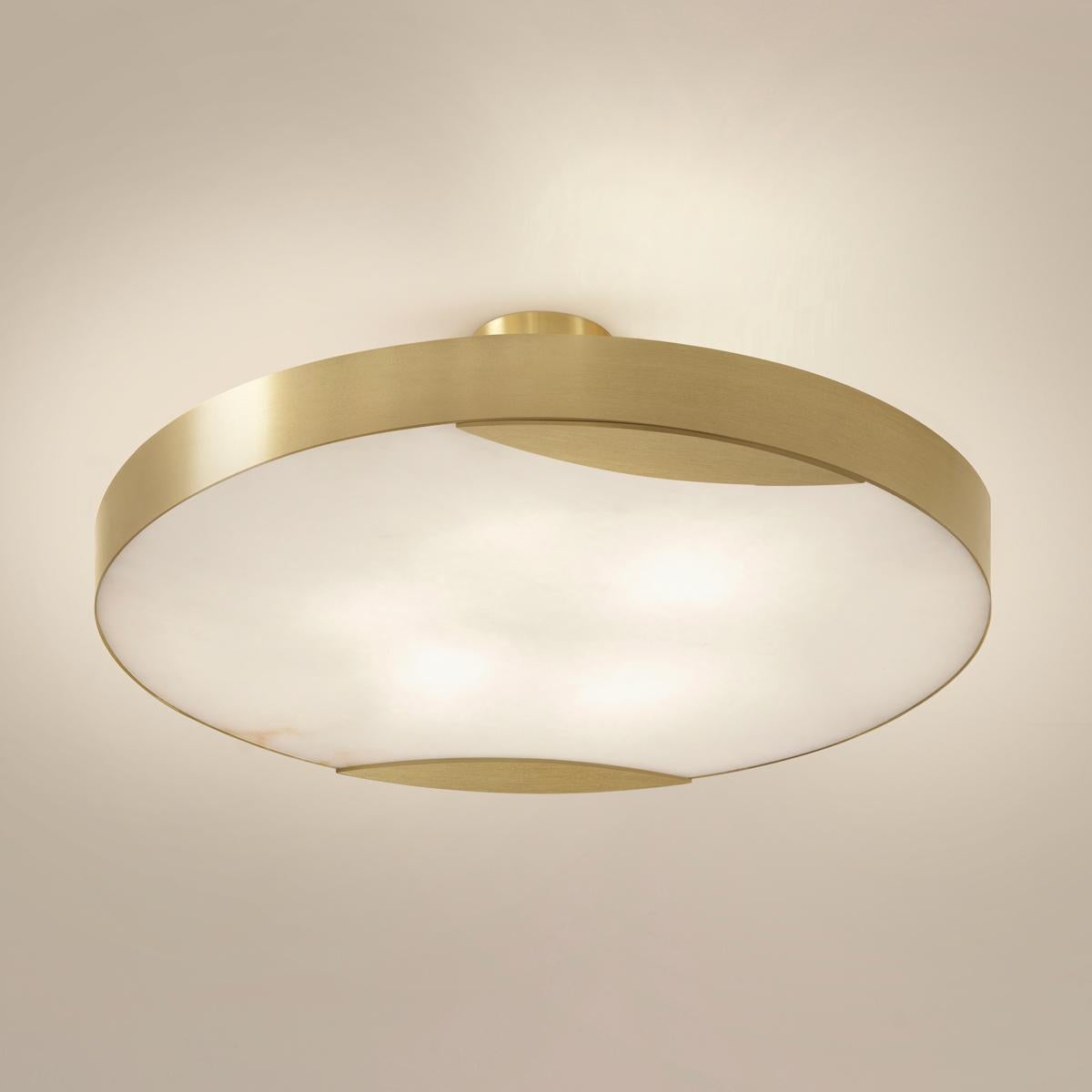 The Cloud N.1 ceiling light embodies a minimalist design with a clean brass band and a glowing Tuscan alabaster diffuser. Available in 4 sizes and can be installed as a semi flush mount or pendant.

Shown in the primary images in satin