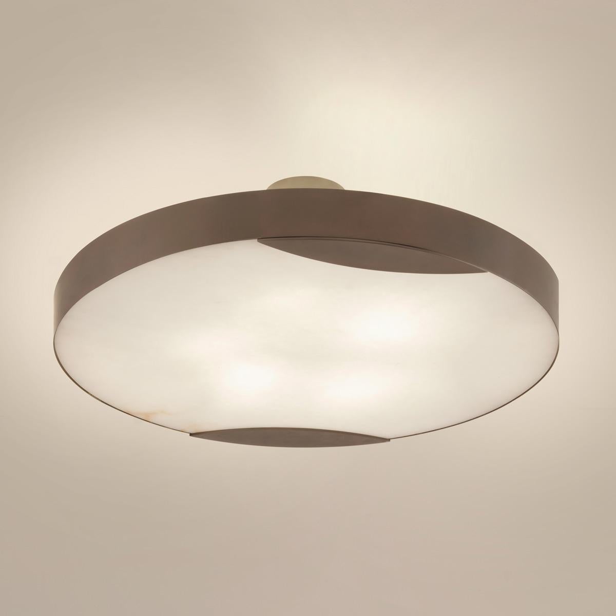 The Cloud N.1 ceiling light embodies a minimalist design with a clean brass band and a glowing Tuscan alabaster diffuser. Available in 4 sizes and can be installed as a semi flush mount or pendant.

Shown in the primary images in Peltro-subsequent