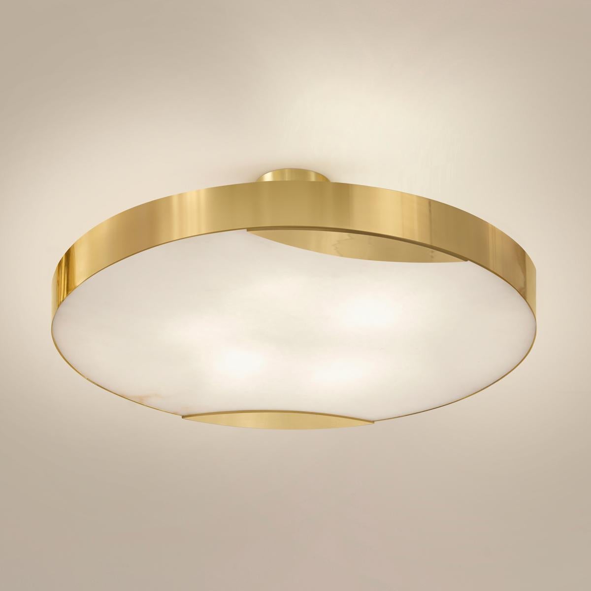 The Cloud N.1 ceiling light embodies a minimalist design with a clean brass band and a glowing Tuscan alabaster diffuser. Available in 4 sizes and can be installed as a semi flush mount or pendant.

Shown in the primary images in polished