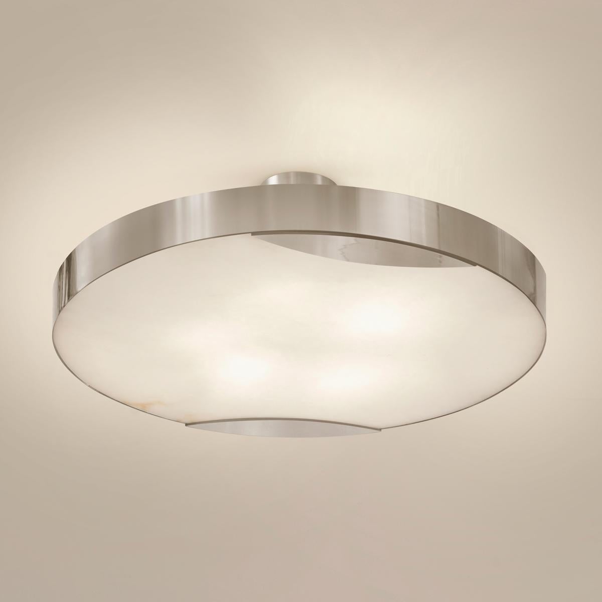 The Cloud N.1 ceiling light embodies a minimalist design with a clean brass band and a glowing Tuscan alabaster diffuser. Available in 4 sizes and can be installed as a semi flush mount or pendant.

Shown in the primary images in polished