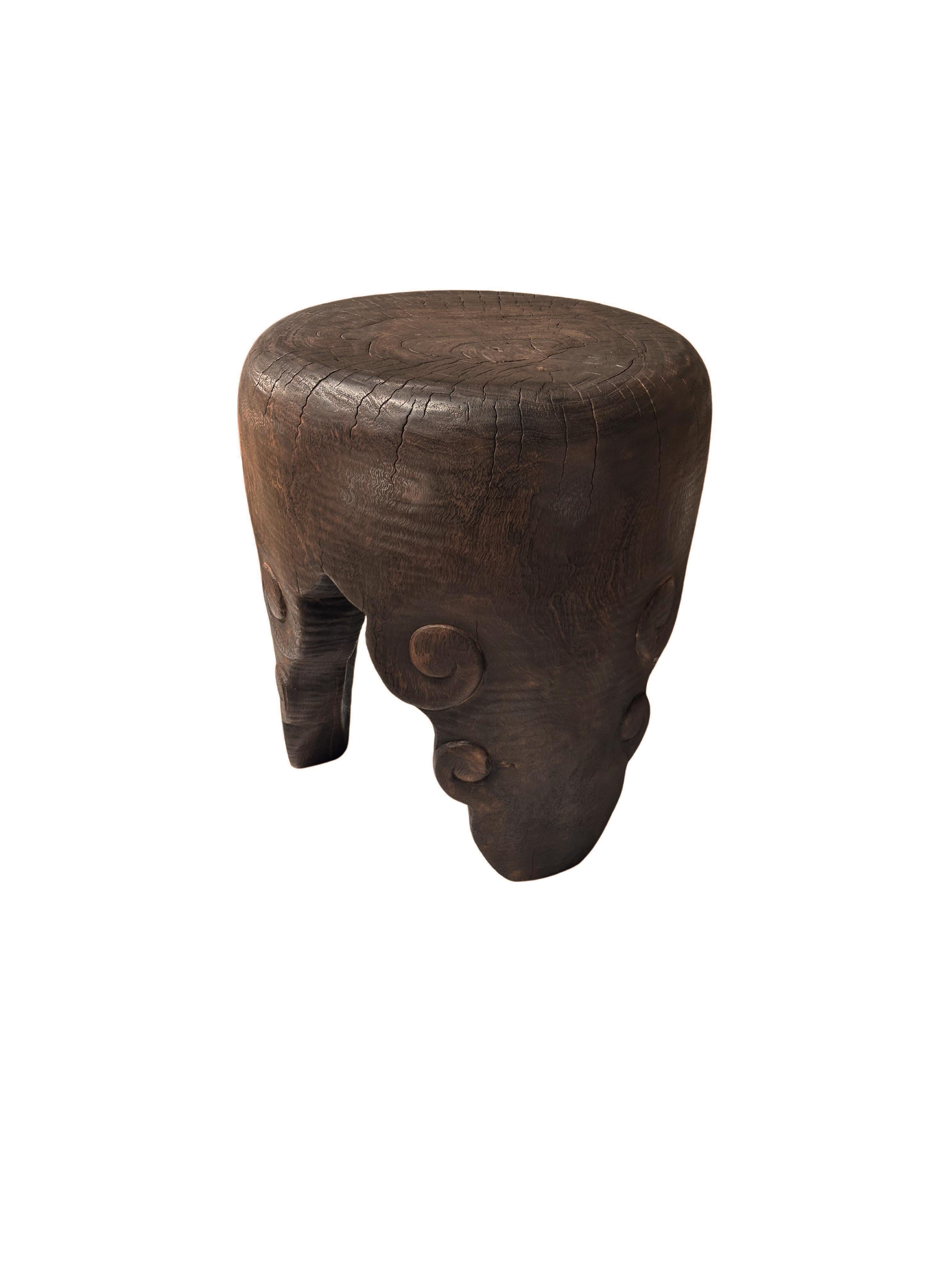 Introducing our exquisite hand-crafted mango wood side table, a perfect blend of elegance and artistry. Each table features a stunning cloud pattern meticulously carved into the legs, creating a unique visual appeal. The rich, warm tones of the