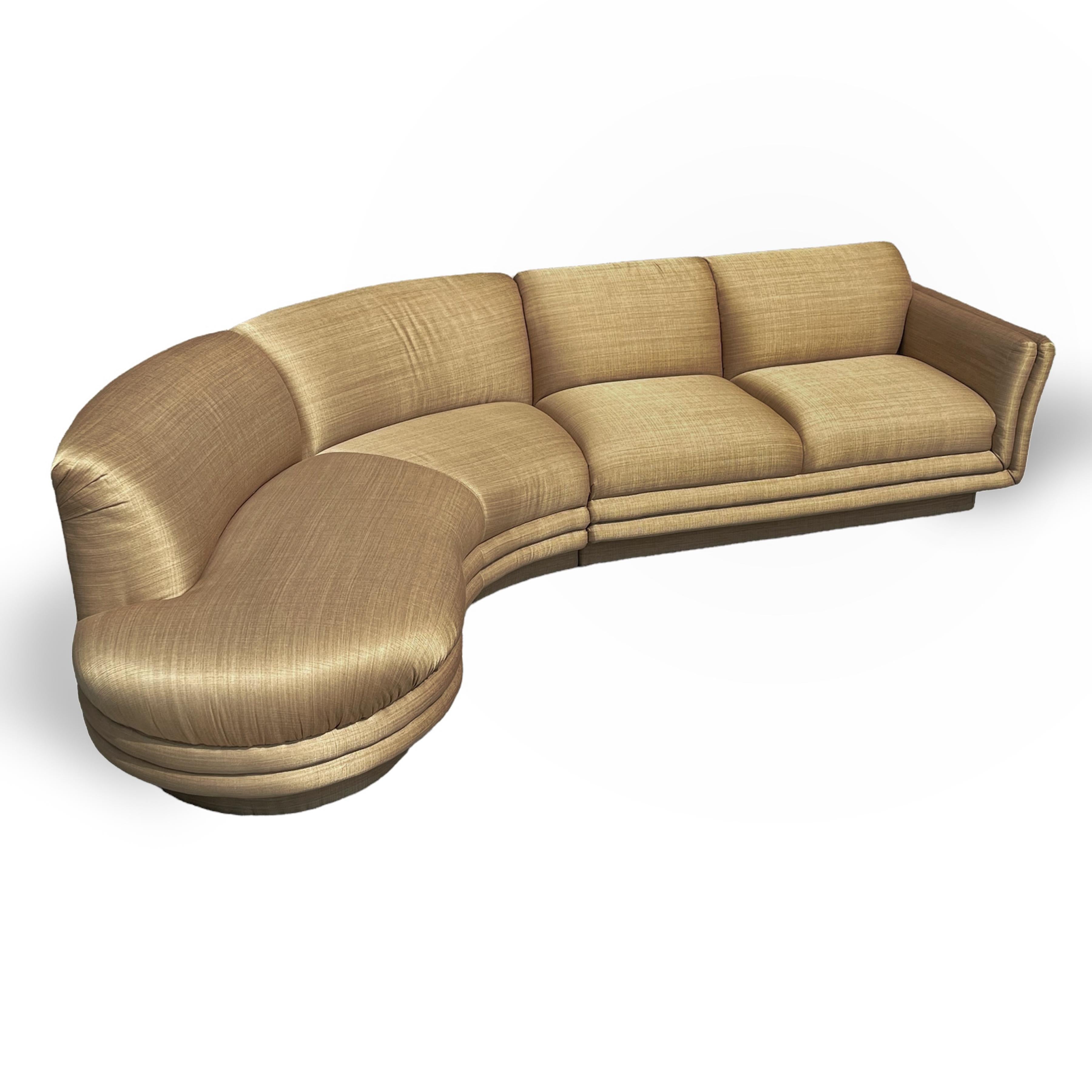 This elegant and comfortable two piece sectional sofa by Preview/ Weiman exhibits great style with its asymmetrical shape and sensuous, curved. open-arm end and floating quality. The sofa is in excellent original condition including the rich, bronze