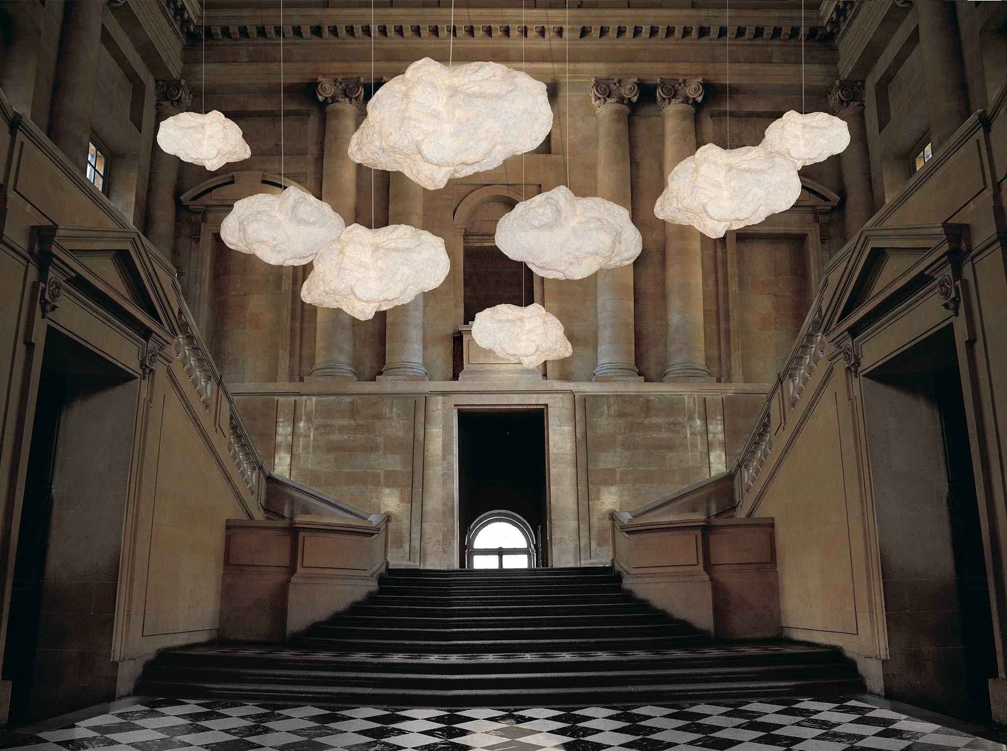 Cloud suspensions - designed by Hae Young Yoon.

Thin cotton fiber is blown into shape by seemingly weightless wire armatures. The delicate forms are stronger than they appear and can be reshaped by hand.
Materials: cotton, powder-coated