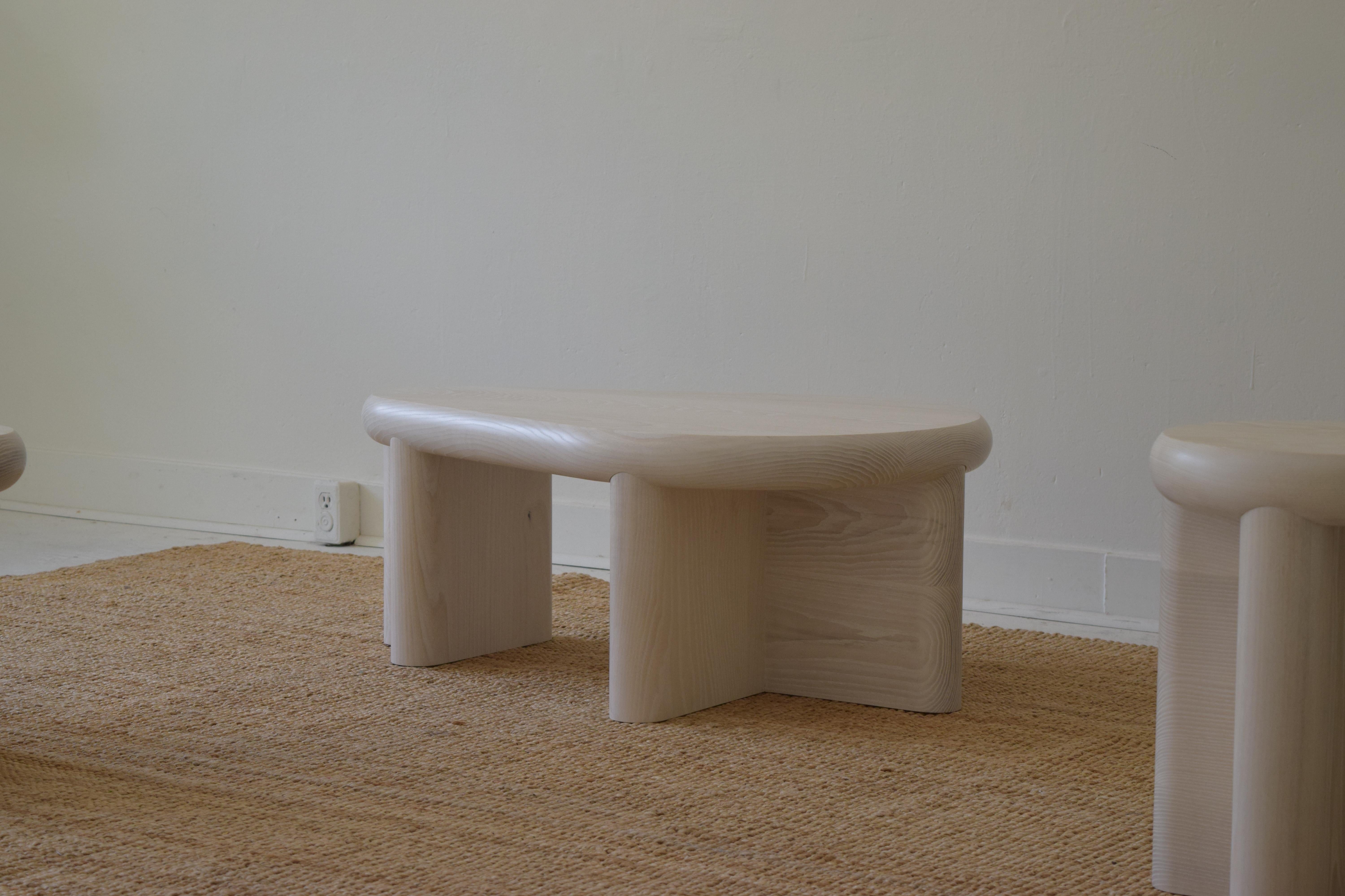 Cloud Table is made of three inch thick solid ash, and finished with a bleach solution to whiten the wood while still showing the unique character of ash. Intended as a low table option, it can also be used as a seating or media unit. 