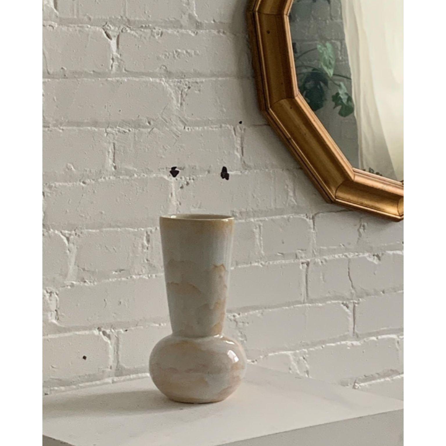 Cloud Vase by Solem Ceramics
Dimensions: D 13 x W 13 x H 33 cm.
Materials: White stoneware, glaze
This vase is water safe. Please contact us.

Solem’s work pulls from memories of the architecture and community within SWANA and Southeast Asia