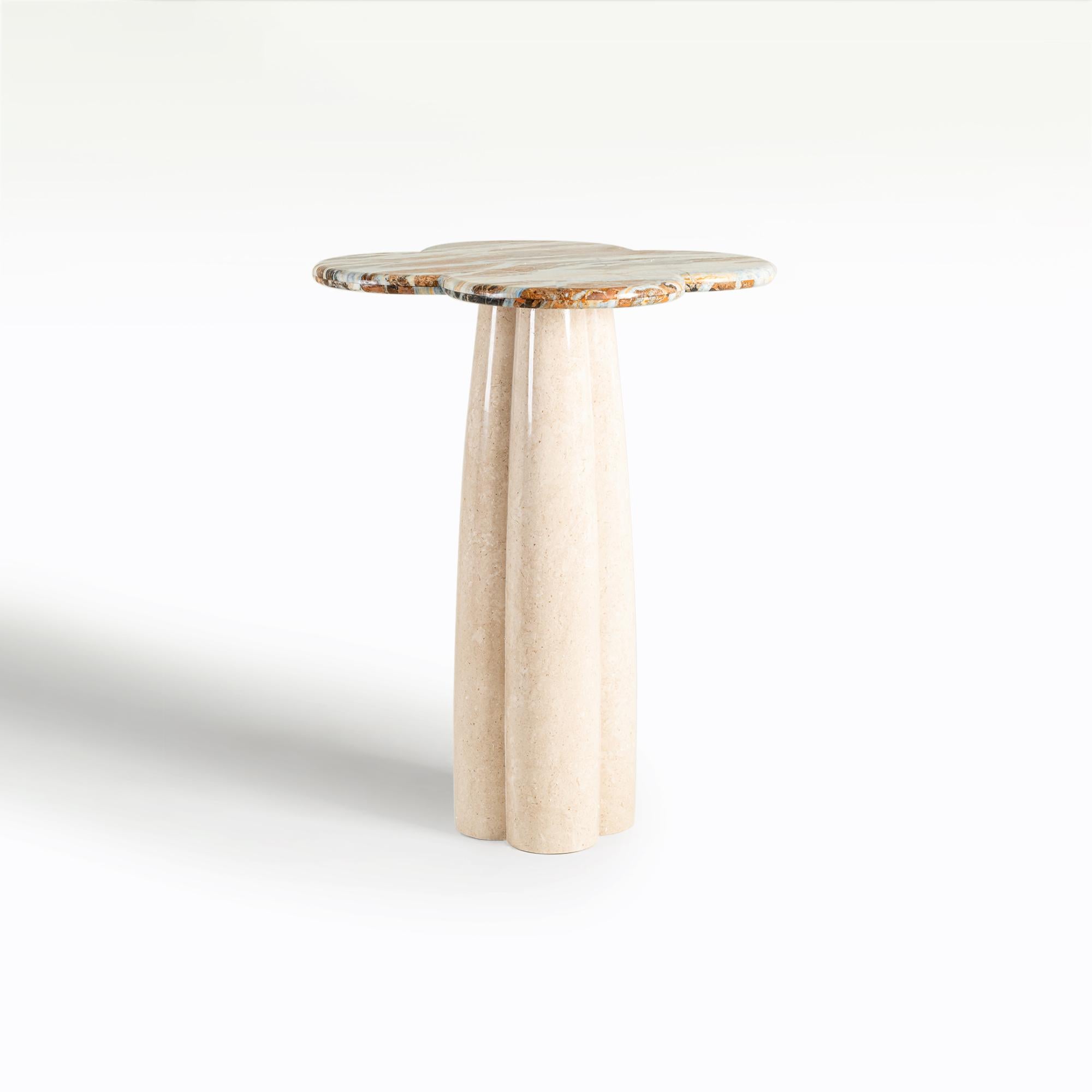 Featuring the stunning four-leaf clover form from the table top all the way to the base, each curve gives a soft touch to this colossal bar table. Made entirely from solid marble stone, this Blue Jeans table is truly an heirloom piece.

Quarried in