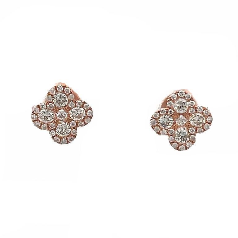 Indulge in the exquisite beauty of these stunning earrings that are sure to make a bold statement. These delicately crafted earrings feature a beautiful clover design made in 14K rose gold with white round diamonds with a total weight of 0.75