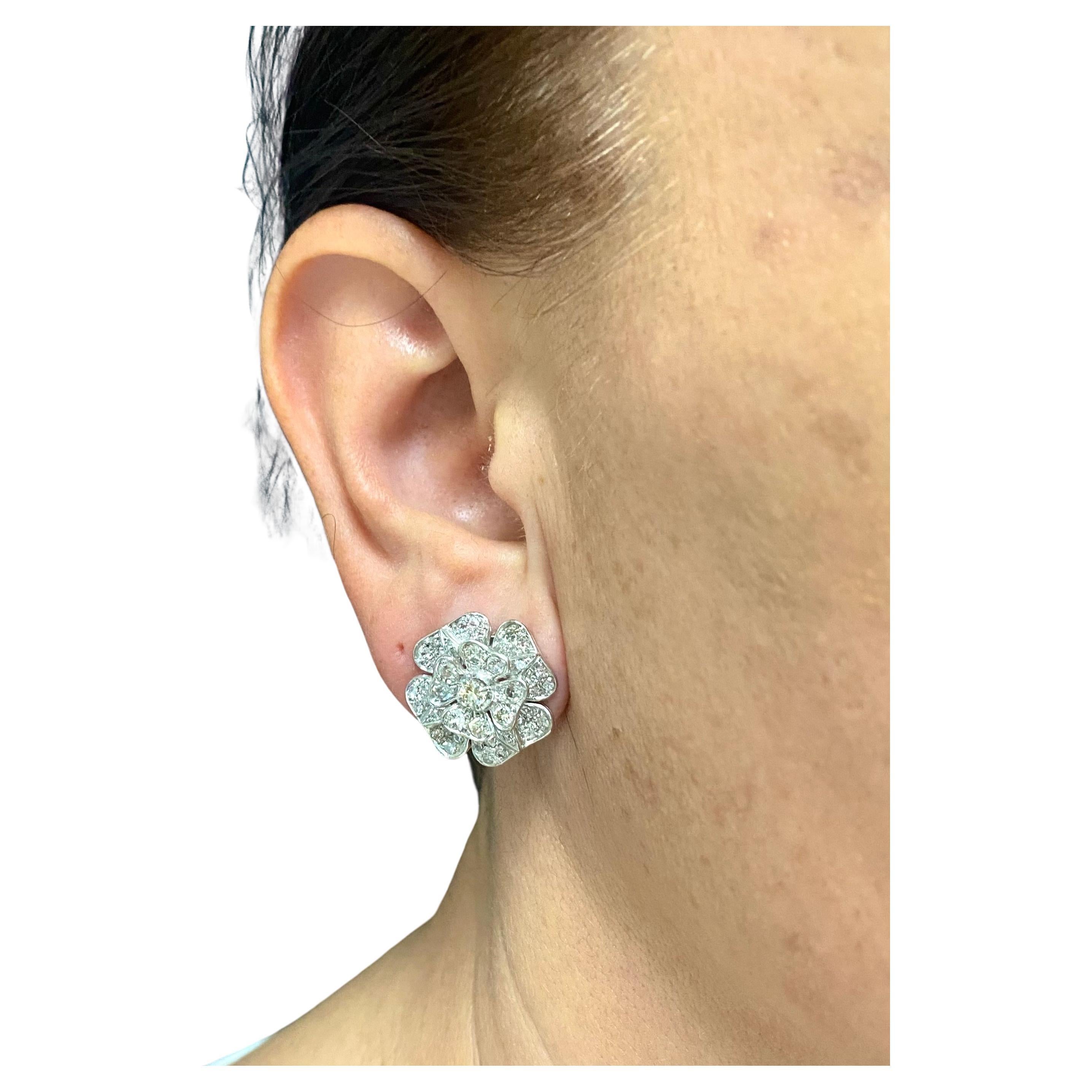 Beautiful clover-shape earrings, made in 18k white gold, feature diamond. 
A very feminine, elegant piece with a floral design. The diamonds are flush mount set which makes gold almost invisible and enhances the whiteness of diamonds. The clover’s