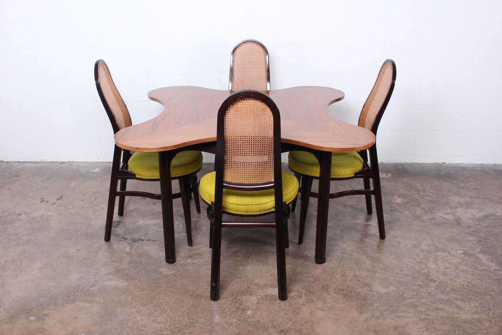 Rosewood and mahogany clover game table designed by Edward Wormley for Dunbar. 

Chairs available separately.