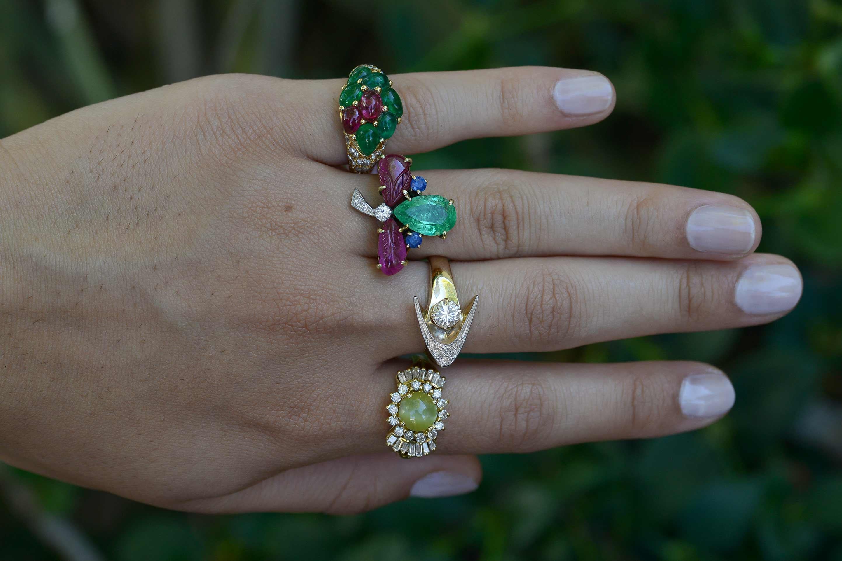 The Keller Tutti Frutti Cocktail Ring. A delicious combination of fine emerald, carved ruby, sapphire and diamonds give this floral, clover flower an awesome allure. Practical enough for a daytime accessory yet dynamic enough for evening wear,