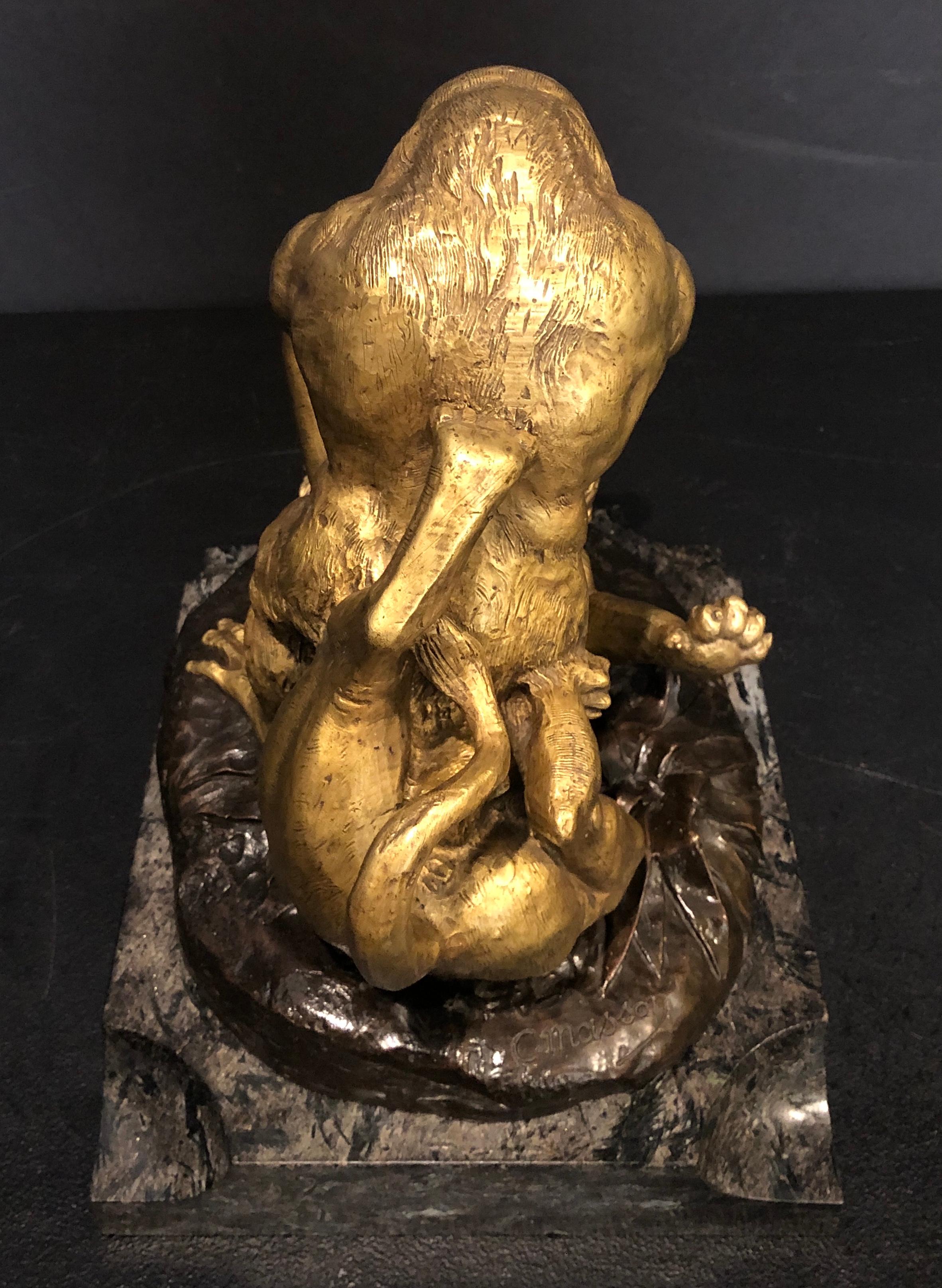 Signed Clovis Edmond Masson (1838-1913) bronze sculpture of gorilla in battle with lion. 19th century gilt and patinated bronze mounted on marble base. French 19th century.